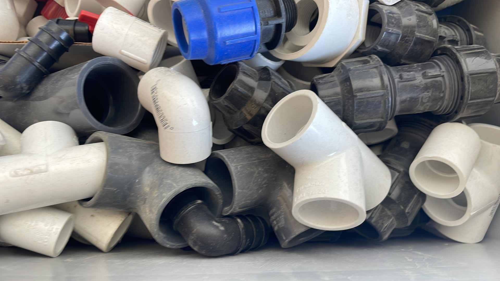 Photo 1 of BOXPLUS 24”x16”x17” FULL OF VARIOUS PVC TEES, ELBOWS, JUNCTIONS,  VALVES