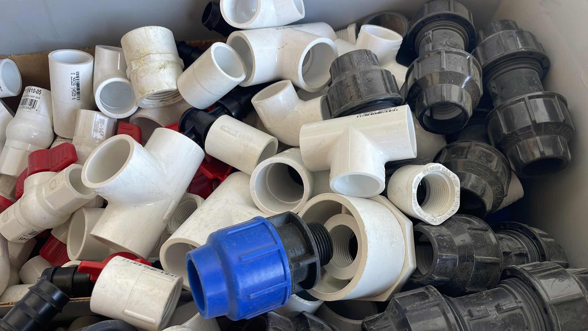 Photo 1 of BOXPLUS 24”x16”x17” FULL OF VARIOUS PVC TEES, ELBOWS, JUNCTIONS,  VALVES