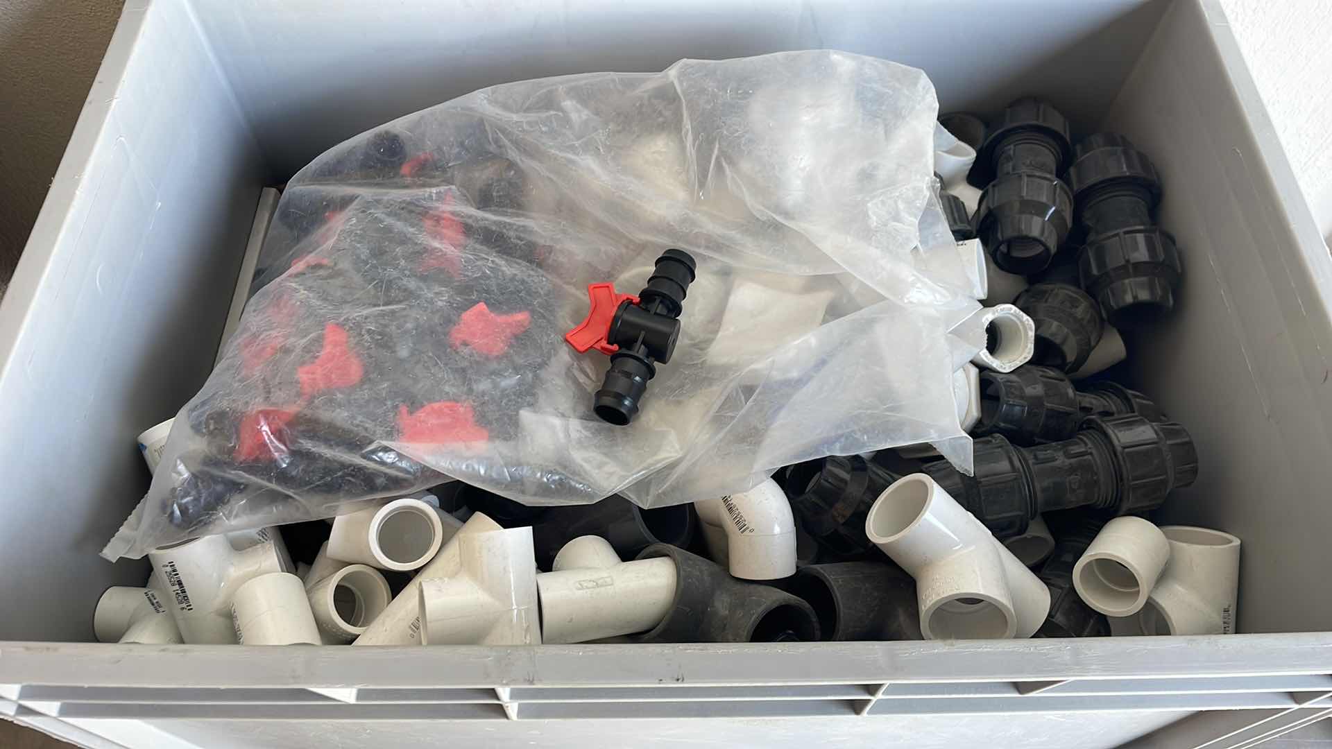 Photo 1 of BOXPLUS 24”x16”x17” FULL OF VARIOUS PVC TEES, ELBOWS, JUNCTIONS,  VALVES