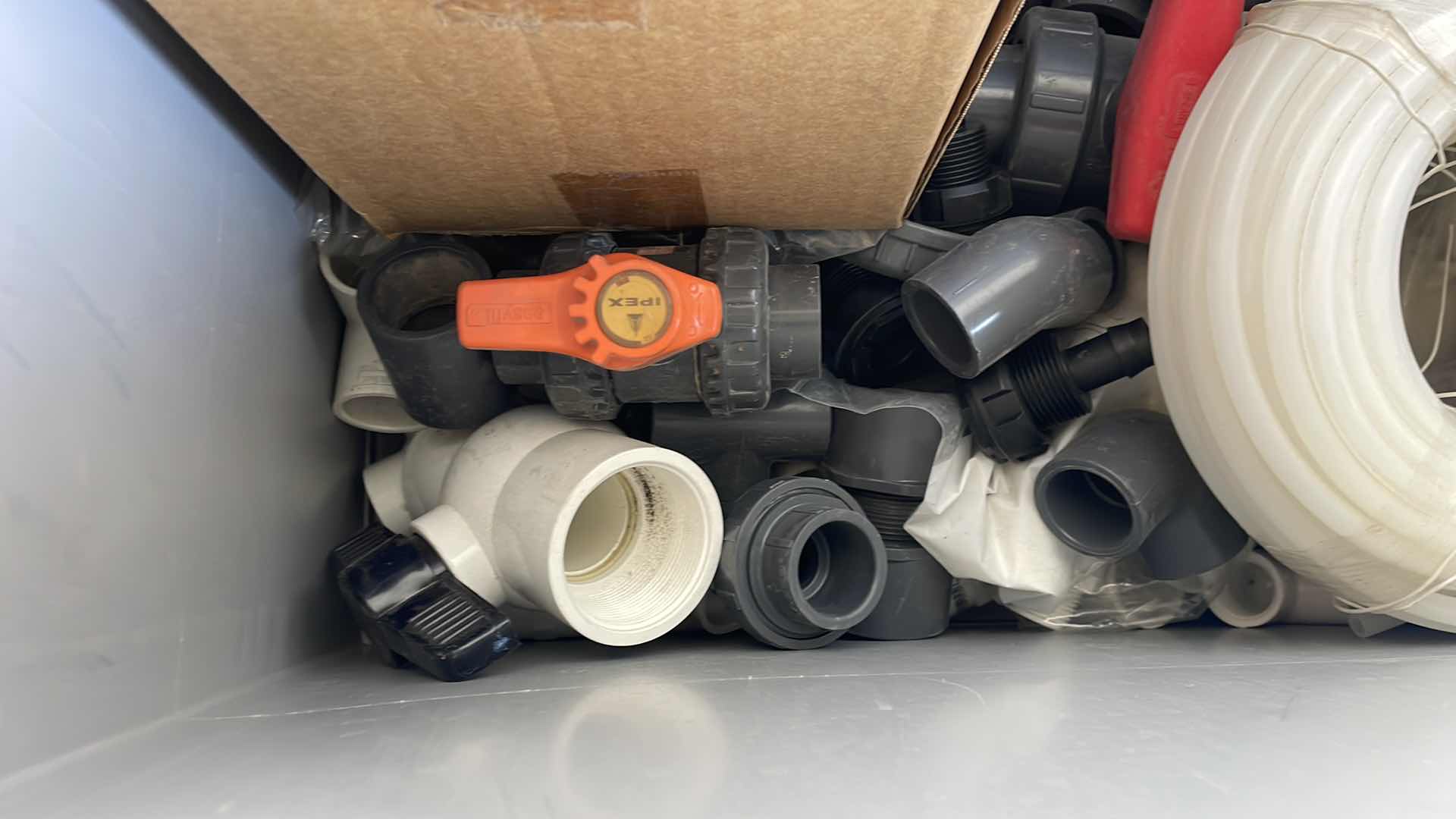 Photo 1 of BOXPLUS 24”x16”x17” FULL OF VARIOUS PVC TEES, ELBOWS, JUNCTIONS,  VALVES, TUBING, CAPS