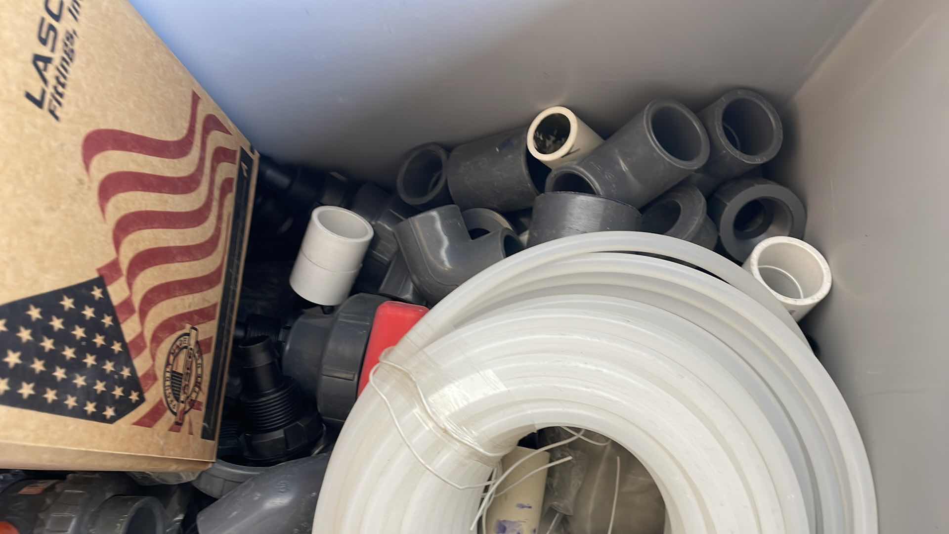 Photo 1 of BOXPLUS 24”x16”x17” FULL OF VARIOUS PVC TEES, ELBOWS, JUNCTIONS,  VALVES, TUBING, CAPS