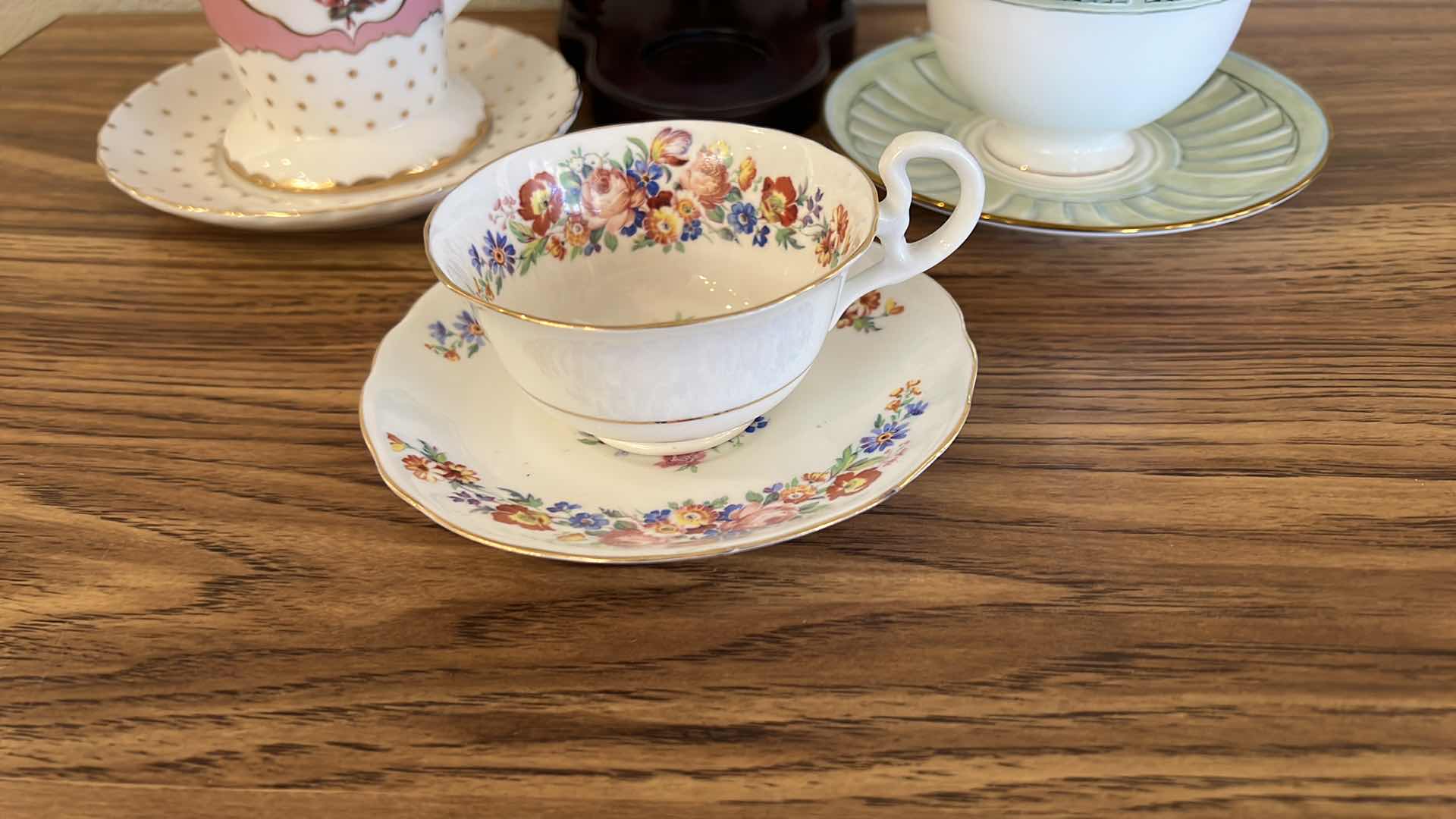 Photo 3 of 3 TEACUPS AND SAUCER SETS, BLUE HEART ON WOOD STAND