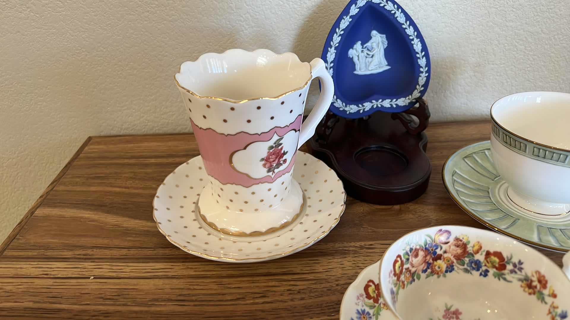 Photo 1 of 3 TEACUPS AND SAUCER SETS, BLUE HEART ON WOOD STAND