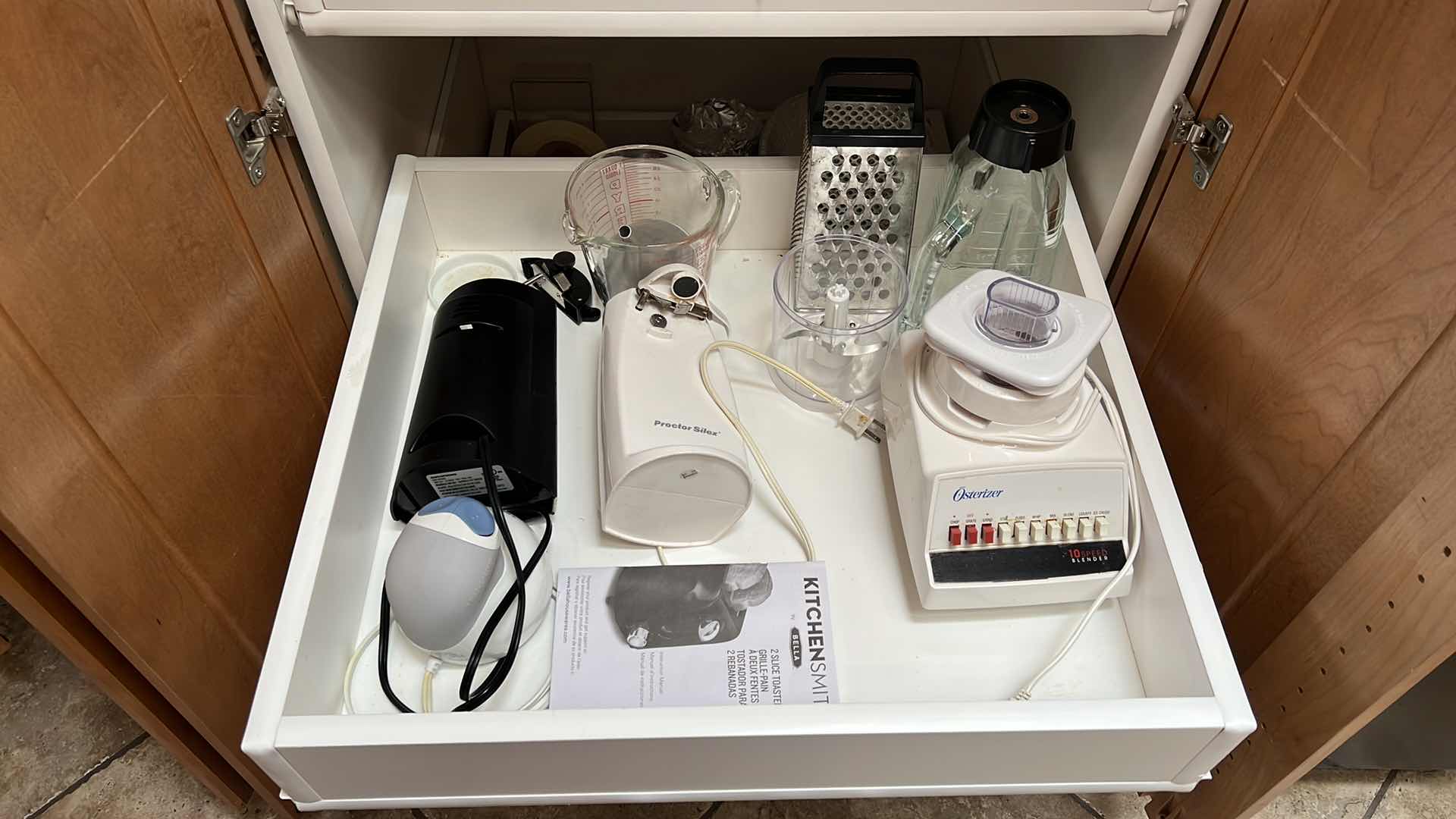 Photo 1 of CONTENTS OF KITCHEN DRAWER (MIXER, CAN OPENER)