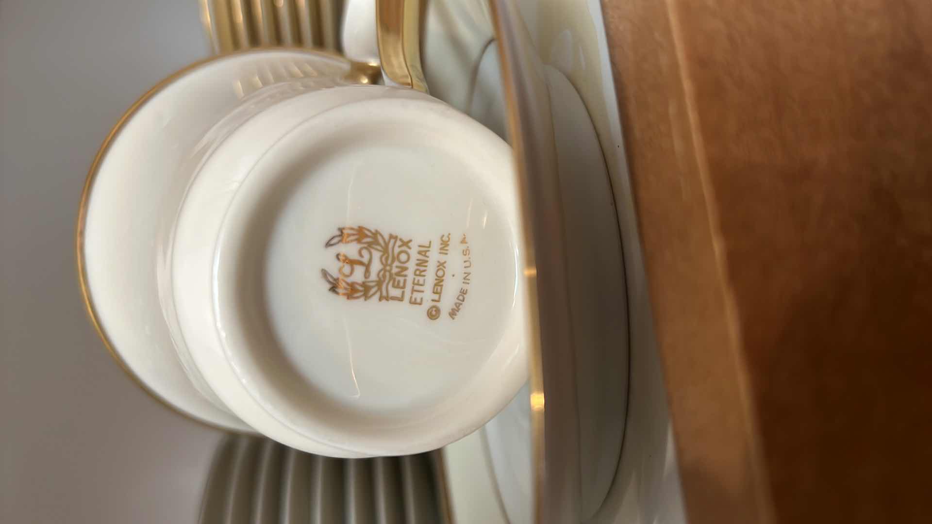 Photo 1 of CONTENTS OF KITCHEN CABINET (LENOX CHINA CUPS AND SAUCERS)