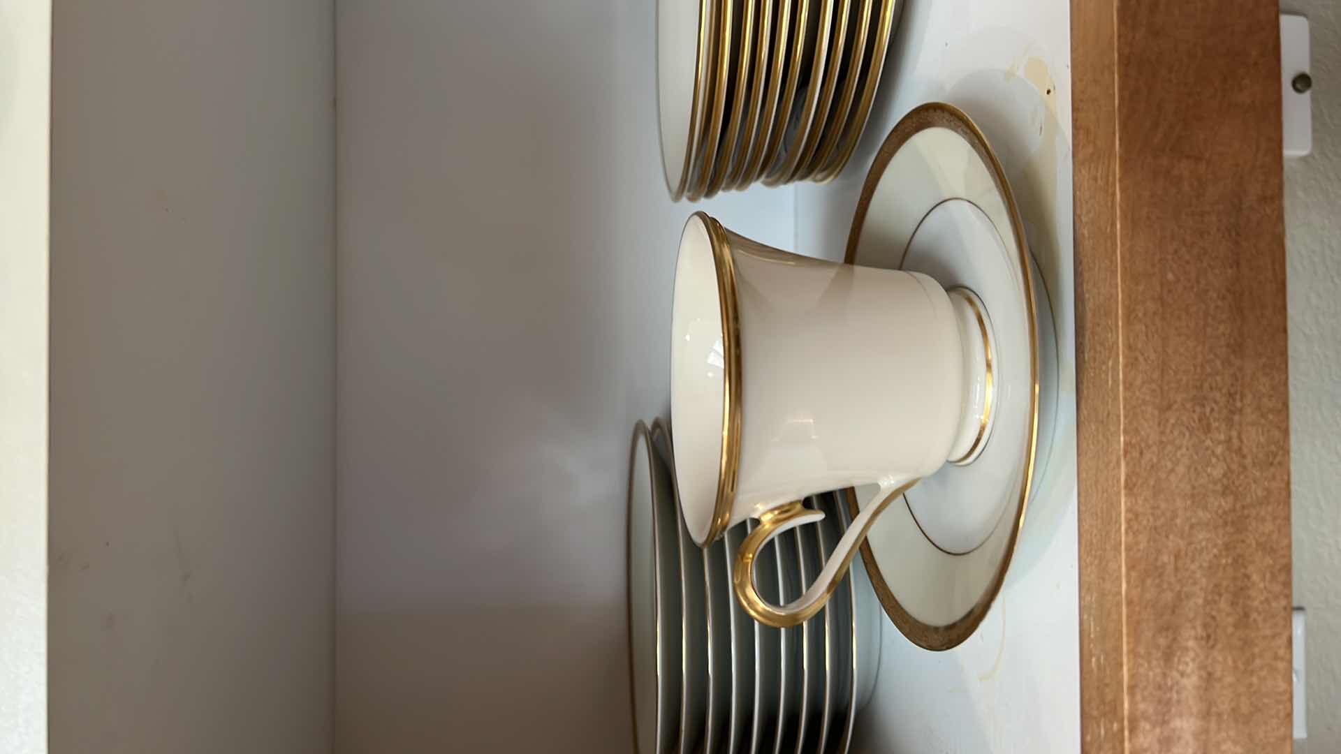 Photo 1 of CONTENTS OF KITCHEN CABINET (LENOX CHINA CUPS AND SAUCERS)