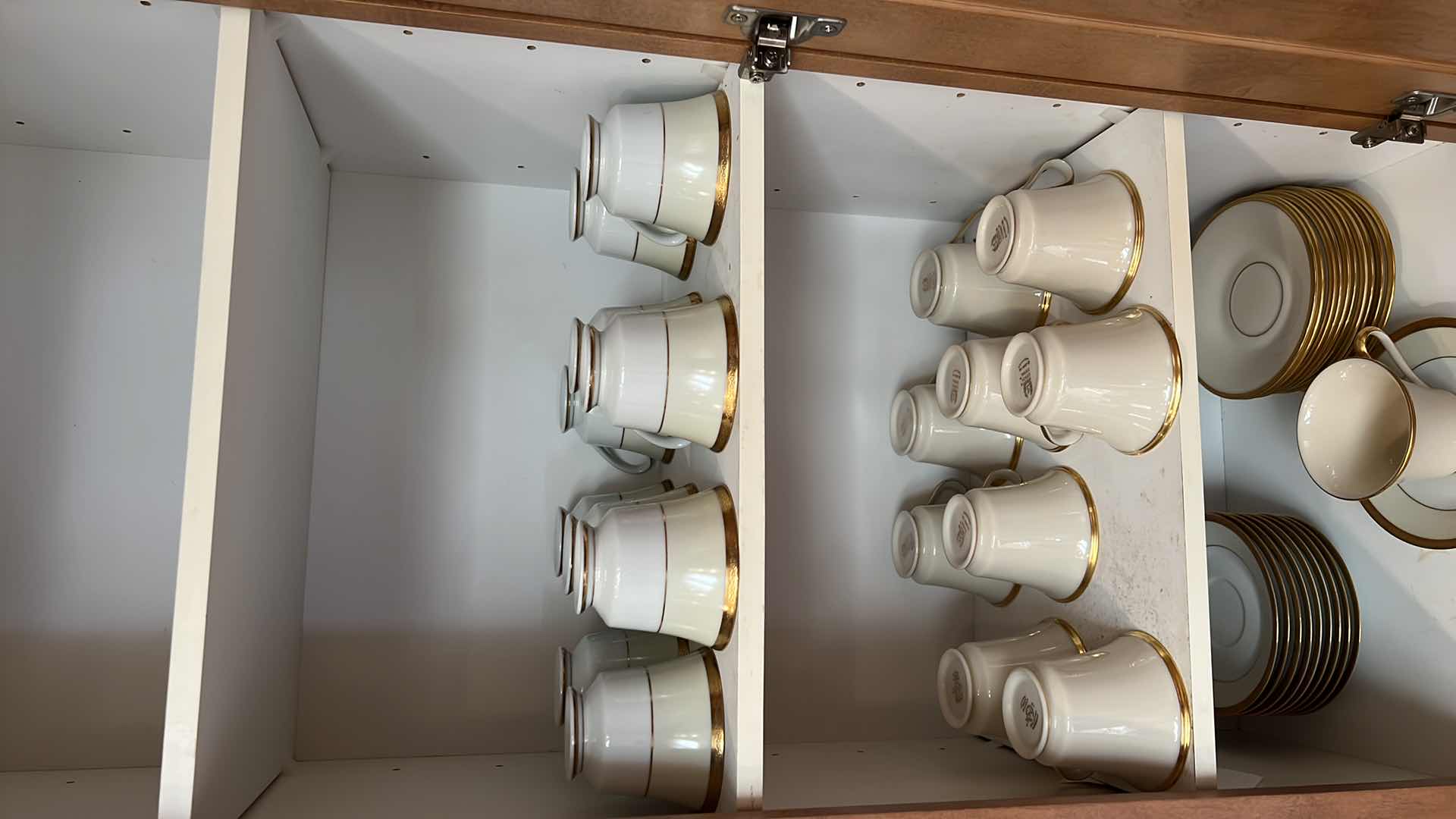 Photo 1 of CONTENTS OF KITCHEN CABINET (LENOX CHINA CUPS AND SAUCERS)