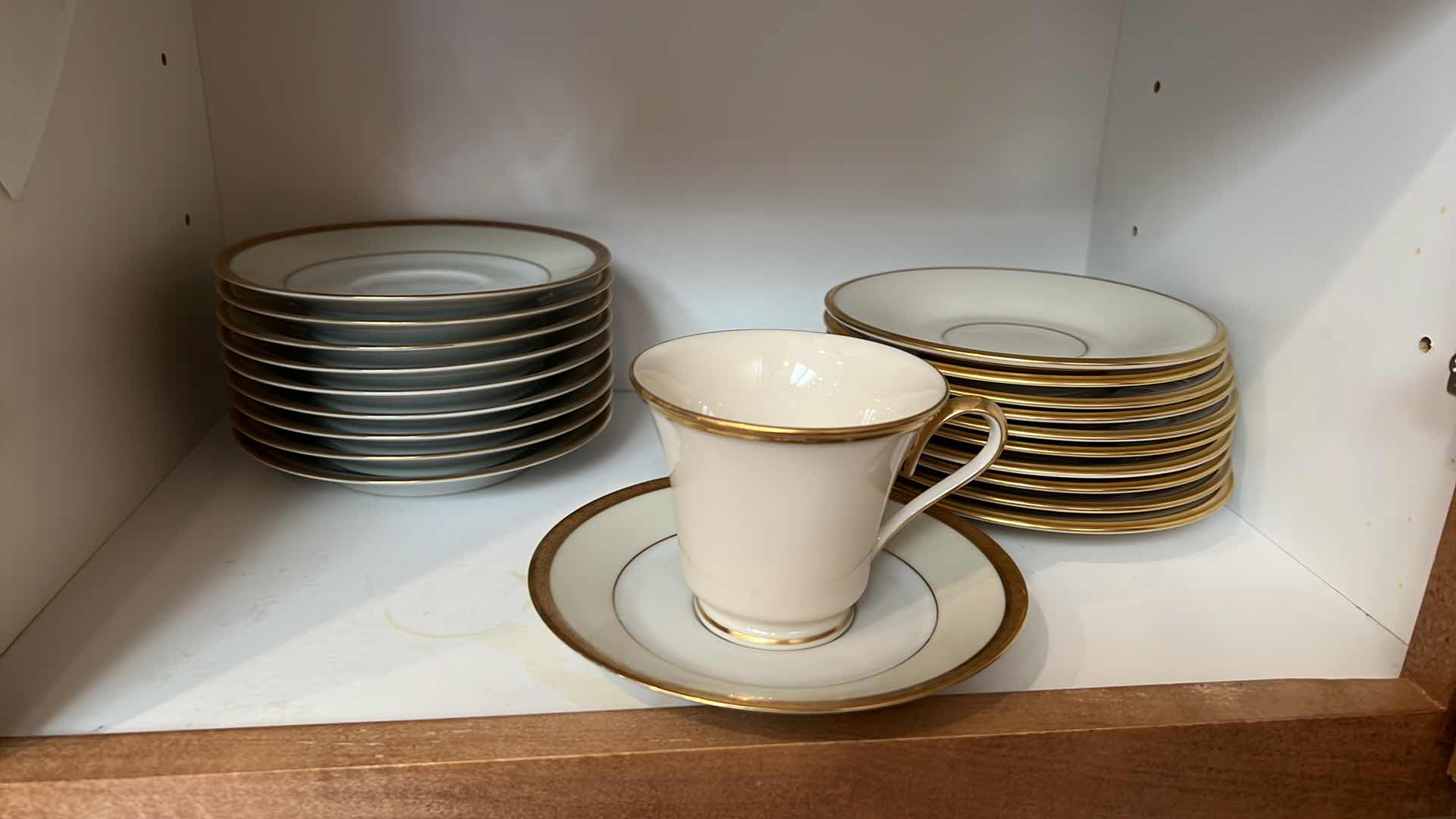 Photo 1 of CONTENTS OF KITCHEN CABINET (LENOX CHINA CUPS AND SAUCERS)