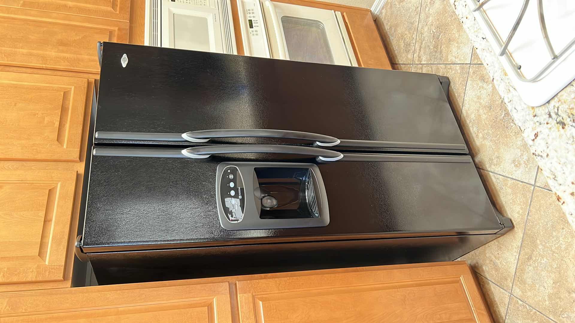 Photo 1 of BLACK MAYTAG SIDE BY SIDE REFRIGERATOR (CONTENTS NOT INCLUDED)