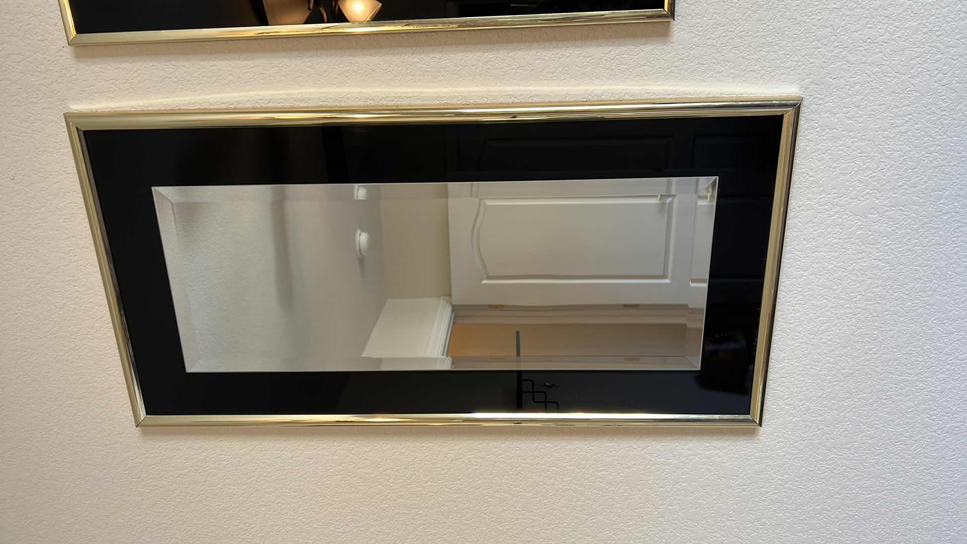 Photo 1 of GOLD TONED FRAMED MIRROR AND SHIP DESIGN WALL HANGINGS