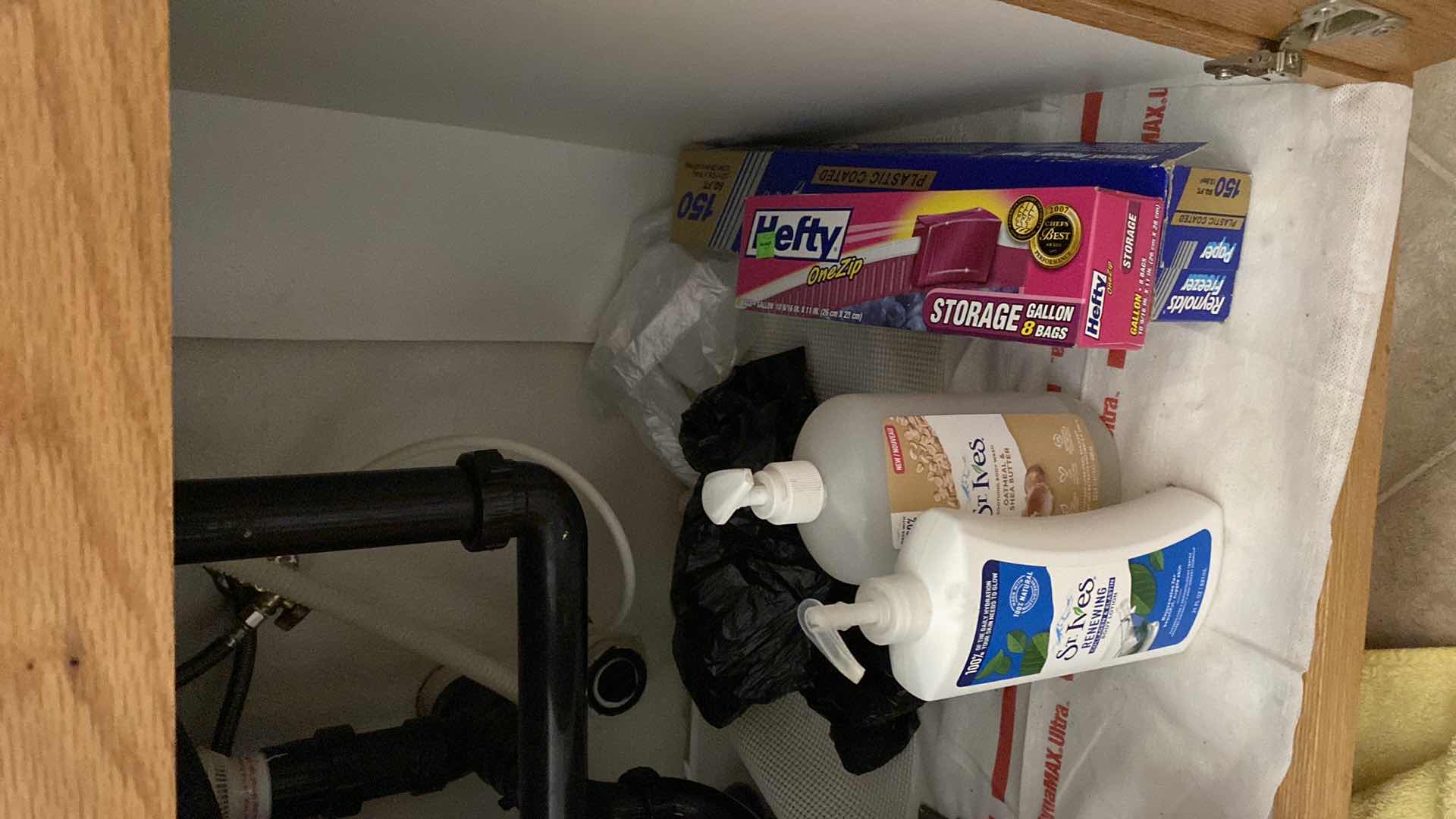 Photo 1 of CONTENTS OF KITCHEN CABINET UNDER SINK