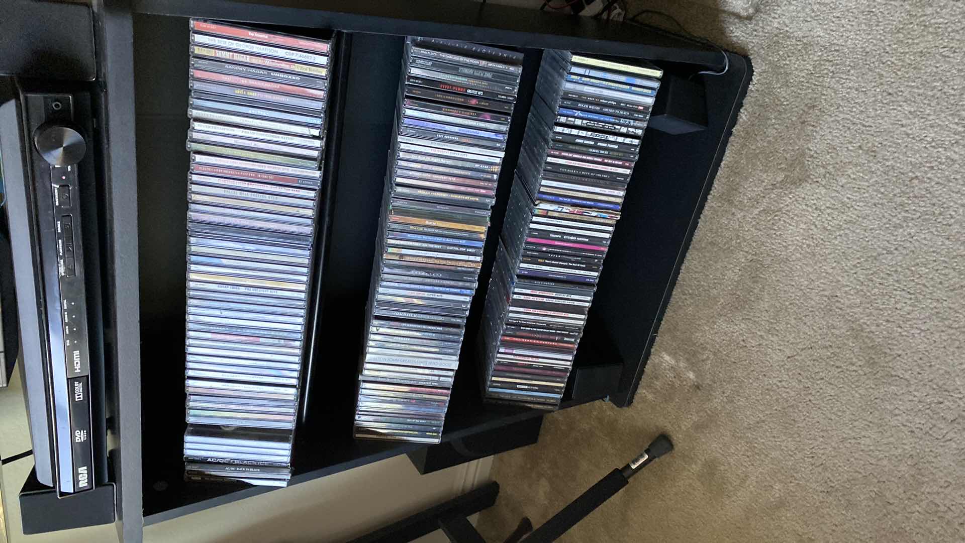 Photo 2 of CD STORAGE UNIT WITH ROCK CDS. 24x10x31H AC/DC JOURNEY PAT BENETAR BOSTON EAGLES PRINCE OZZY & MANY MORE