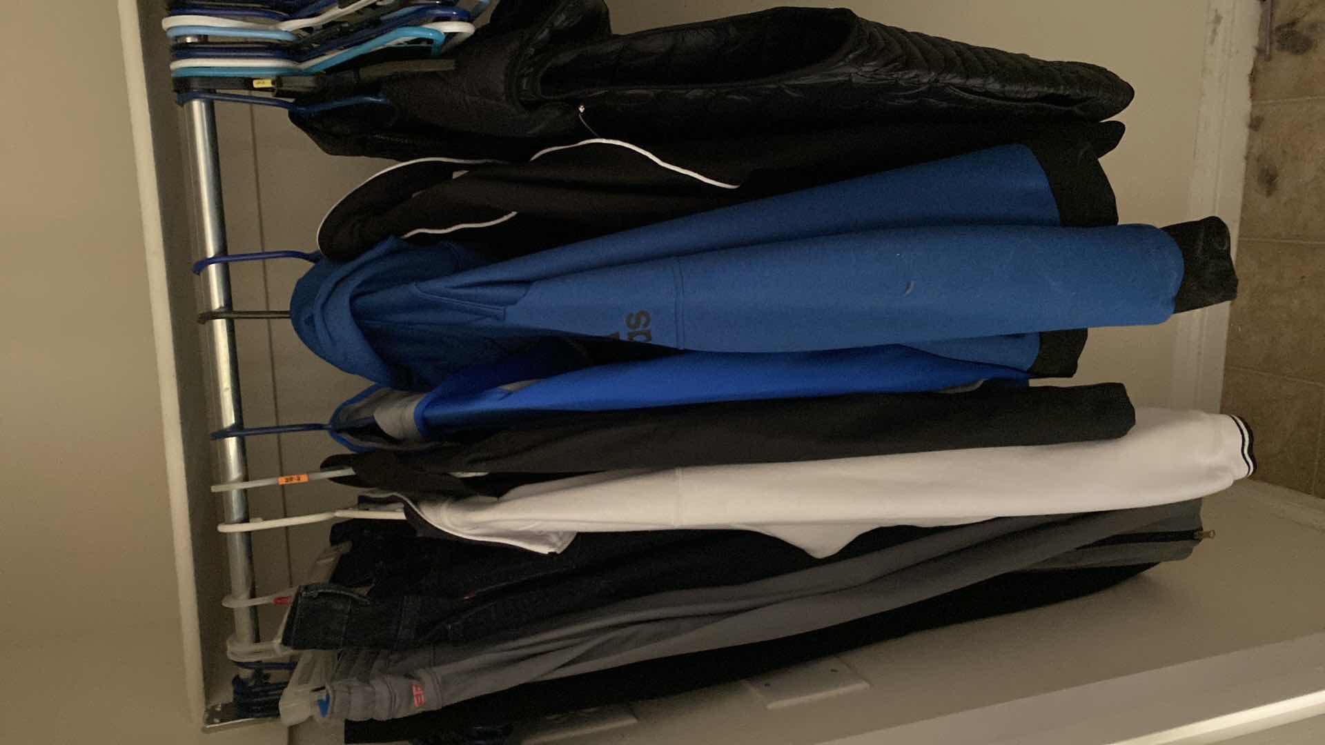 Photo 1 of CONTENTS OF COAT CLOSET MENS 36  & LARGE SWEATS, JEANS