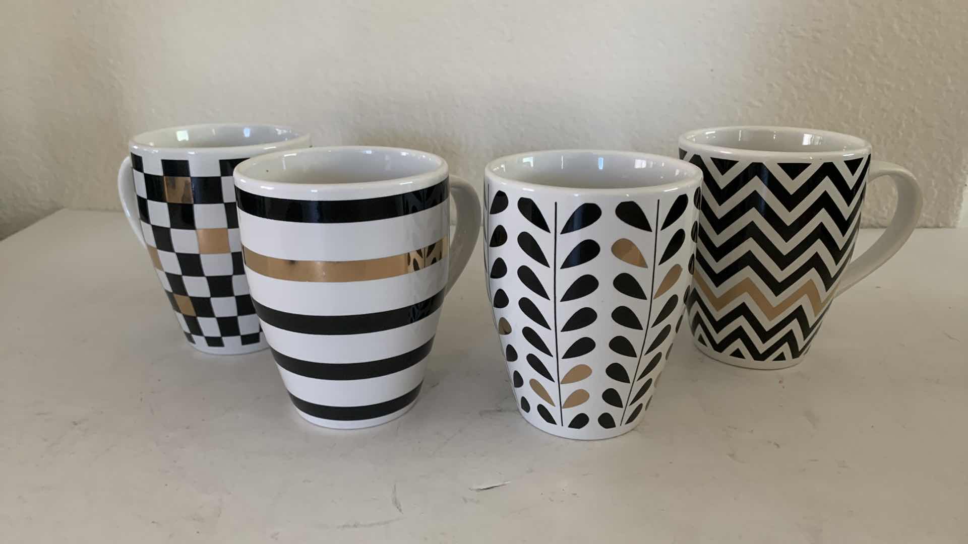 Photo 1 of NIB MACYS BLACK AND WHITE W. GOLD COFFEE MUG SET. (4)