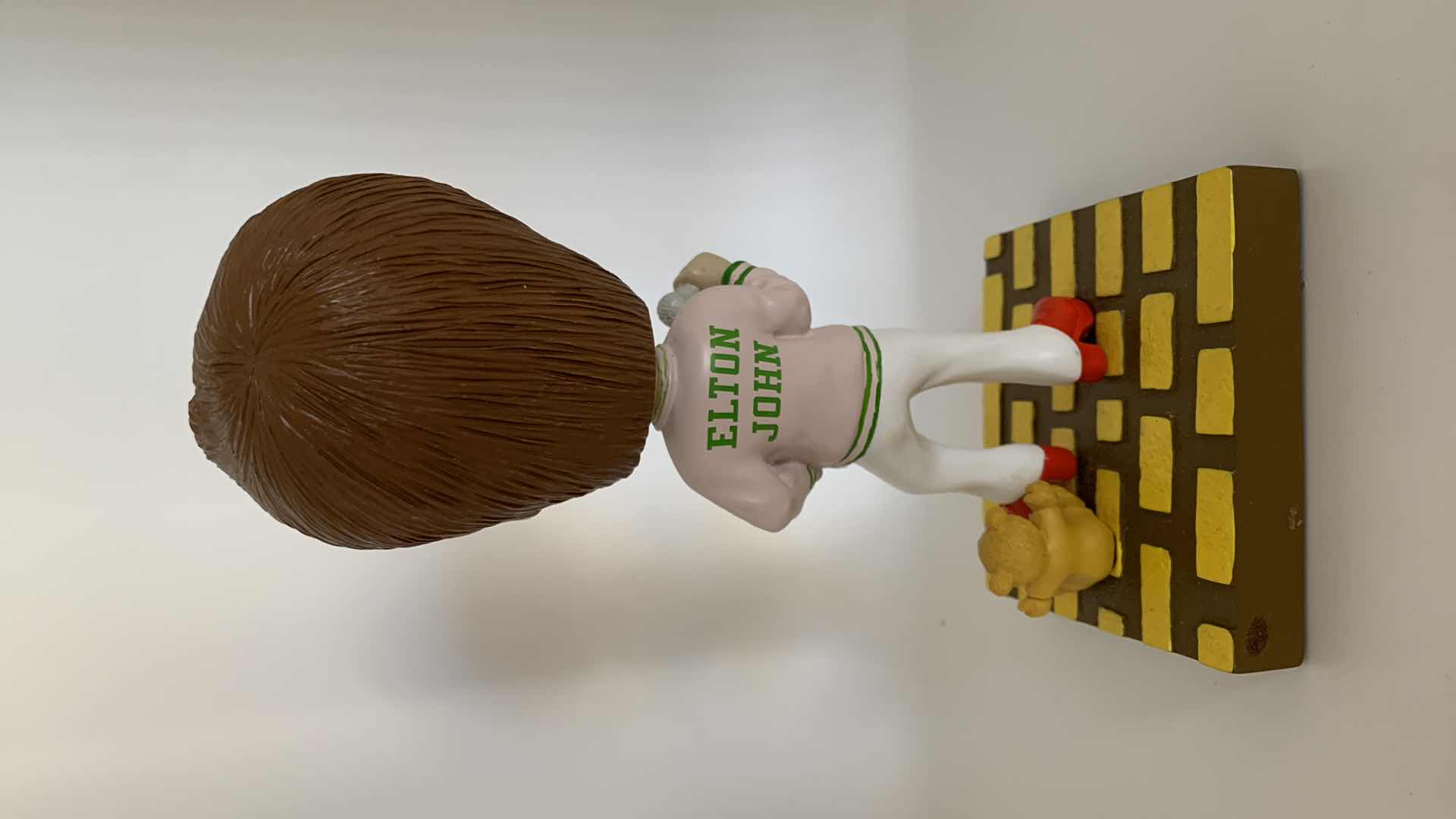 Photo 1 of ELTON JOHN (GOODBYE YELLOW BRICK ROAD) BOBBLE HEAD.