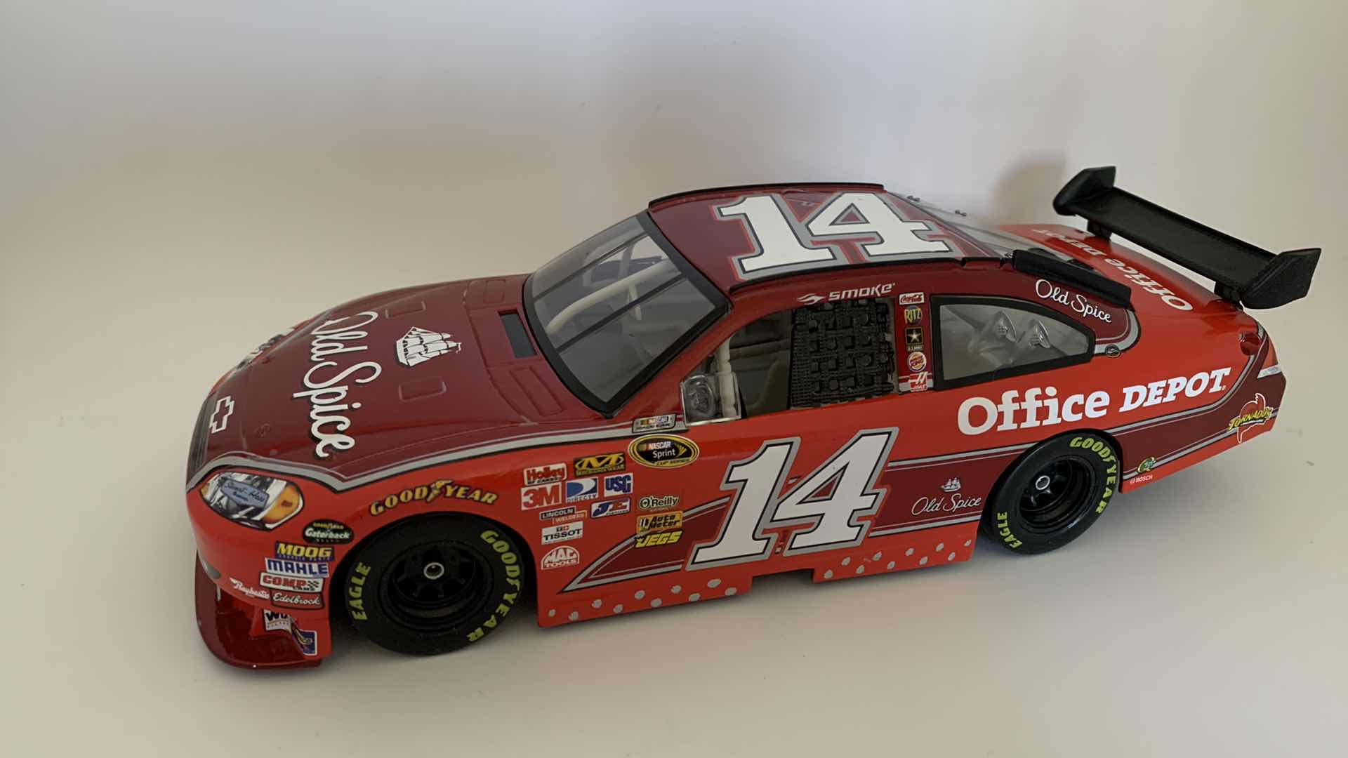 Photo 1 of OLD SPICE #14 TONY STEWART “SMOKE” DIE CAST RACE CAR.