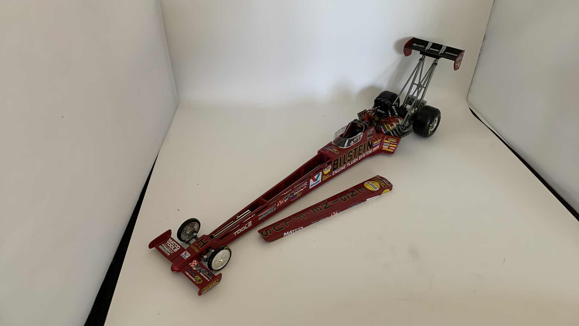 Photo 1 of BILSTEIN ENGINE FLUSH TOP FUEL DIE CAST RACE CAR.