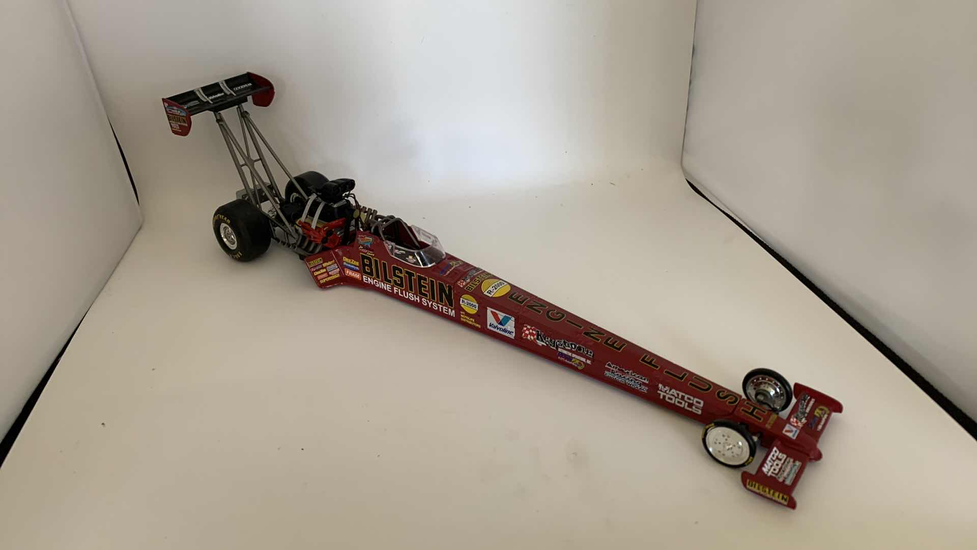 Photo 1 of BILSTEIN ENGINE FLUSH TOP FUEL DIE CAST RACE CAR.