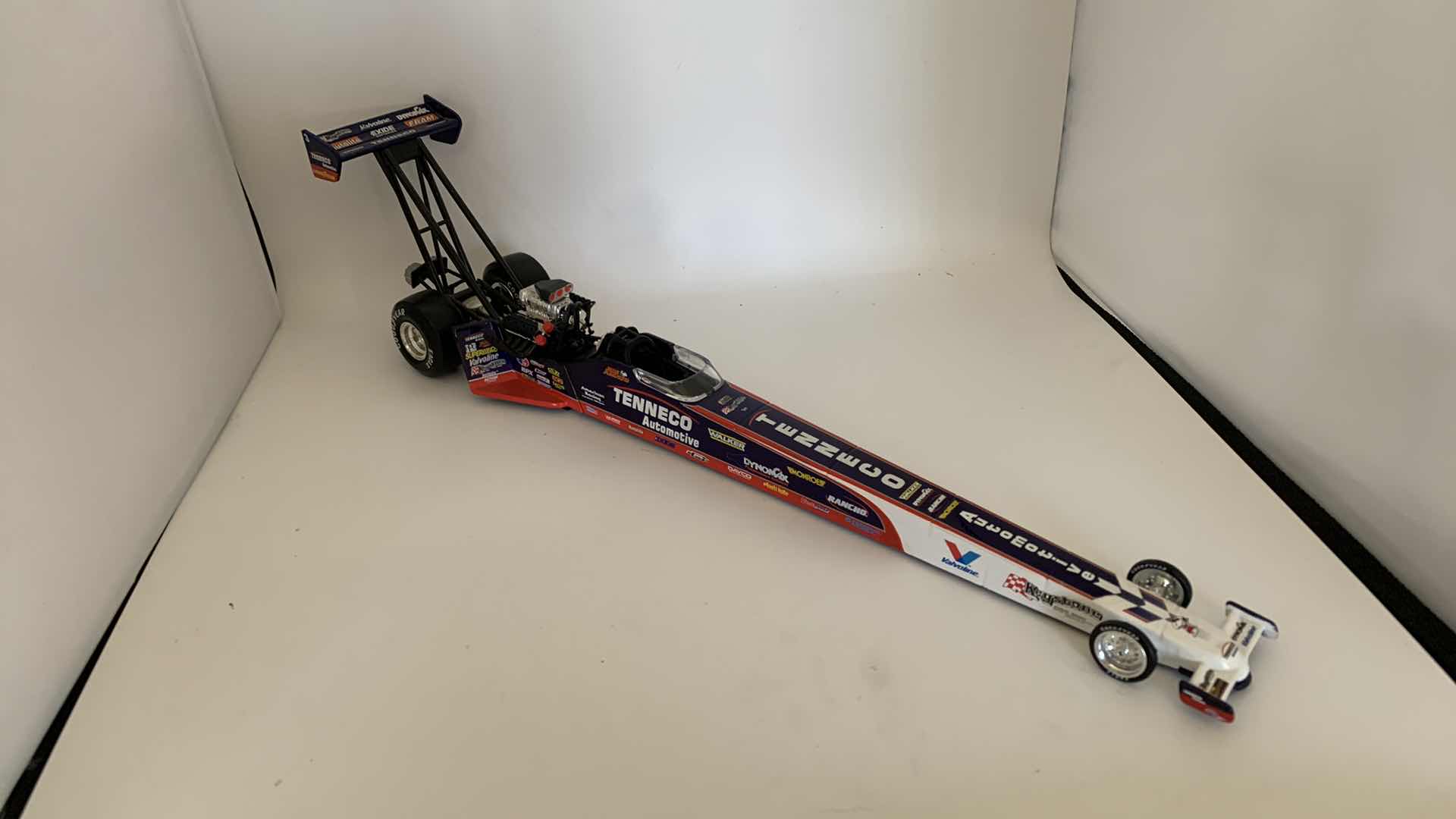 Photo 1 of TENNECO AUTOMOTIVE TOP FUEL DIE CAST RACE CAR.