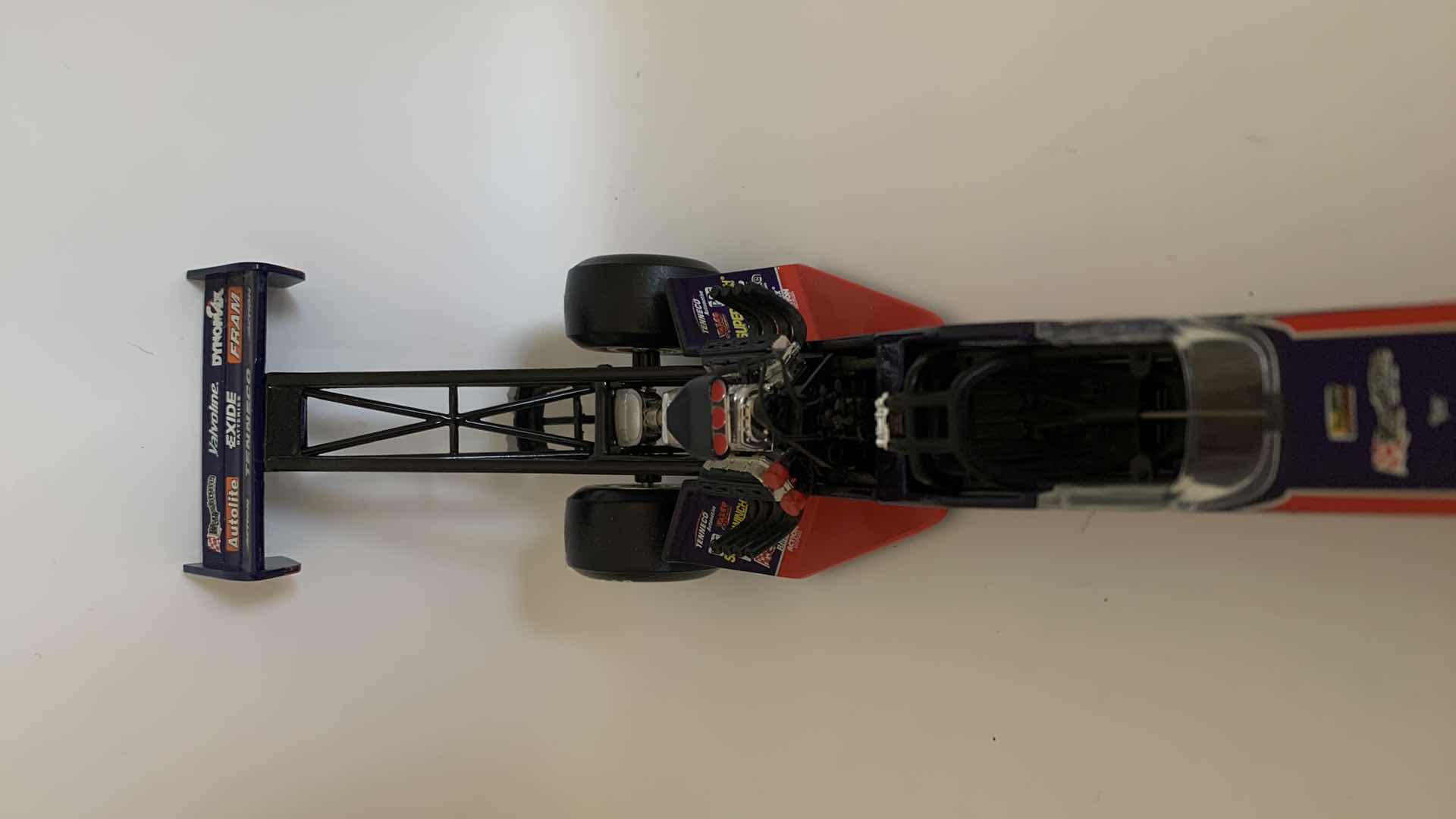 Photo 1 of TENNECO AUTOMOTIVE TOP FUEL DIE CAST RACE CAR.