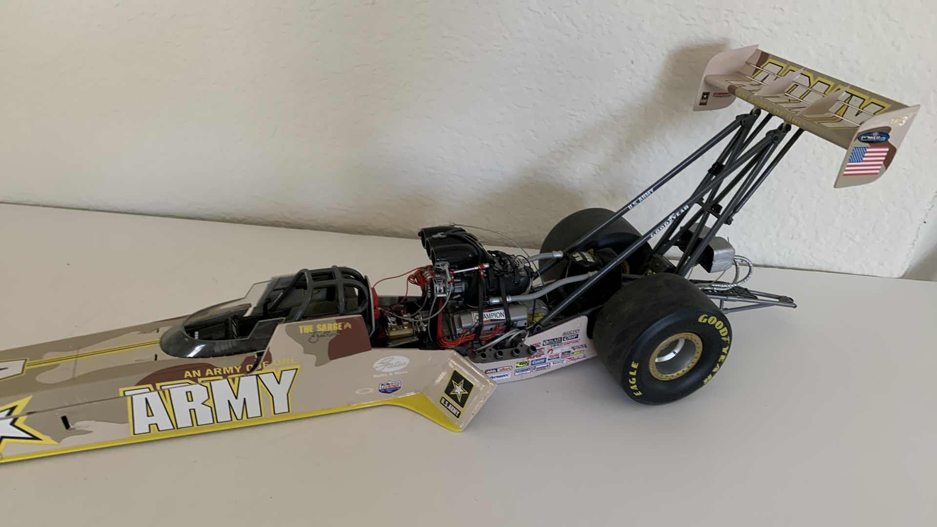 Photo 1 of ARMY TOP FUEL DIE CAST RACE CAR.