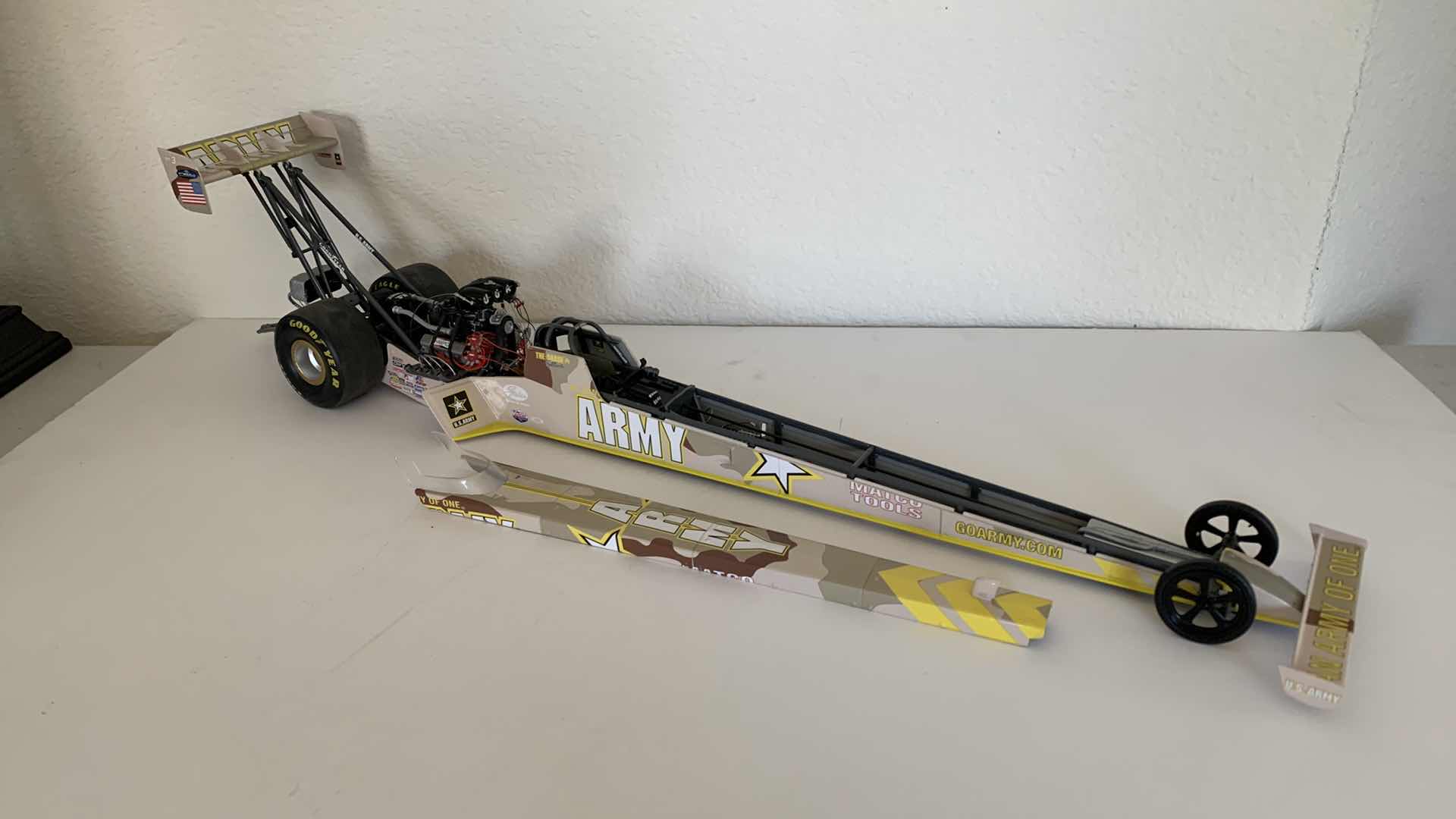 Photo 1 of ARMY TOP FUEL DIE CAST RACE CAR.