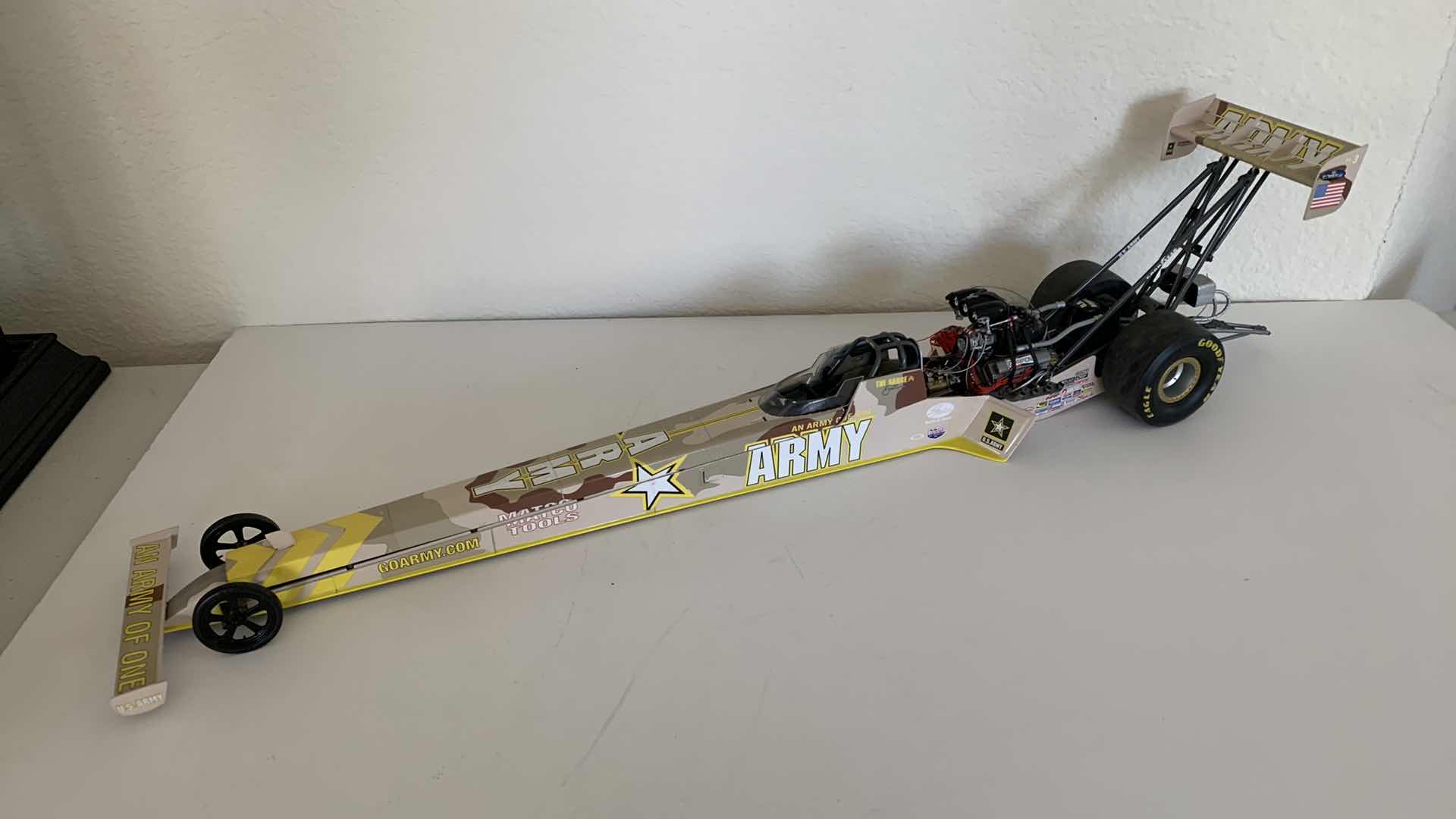 Photo 1 of ARMY TOP FUEL DIE CAST RACE CAR.