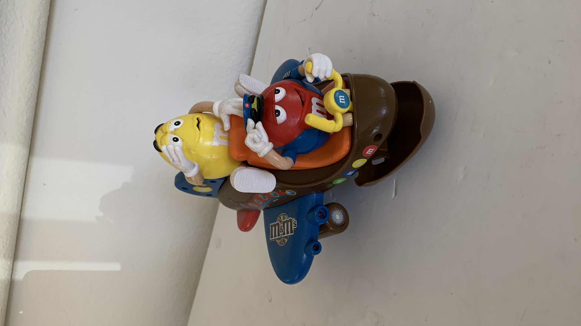 Photo 1 of M & M RED AND YELLOW ON AIRPLANE. COLLECTIBLE CANDY DISPENSER.
