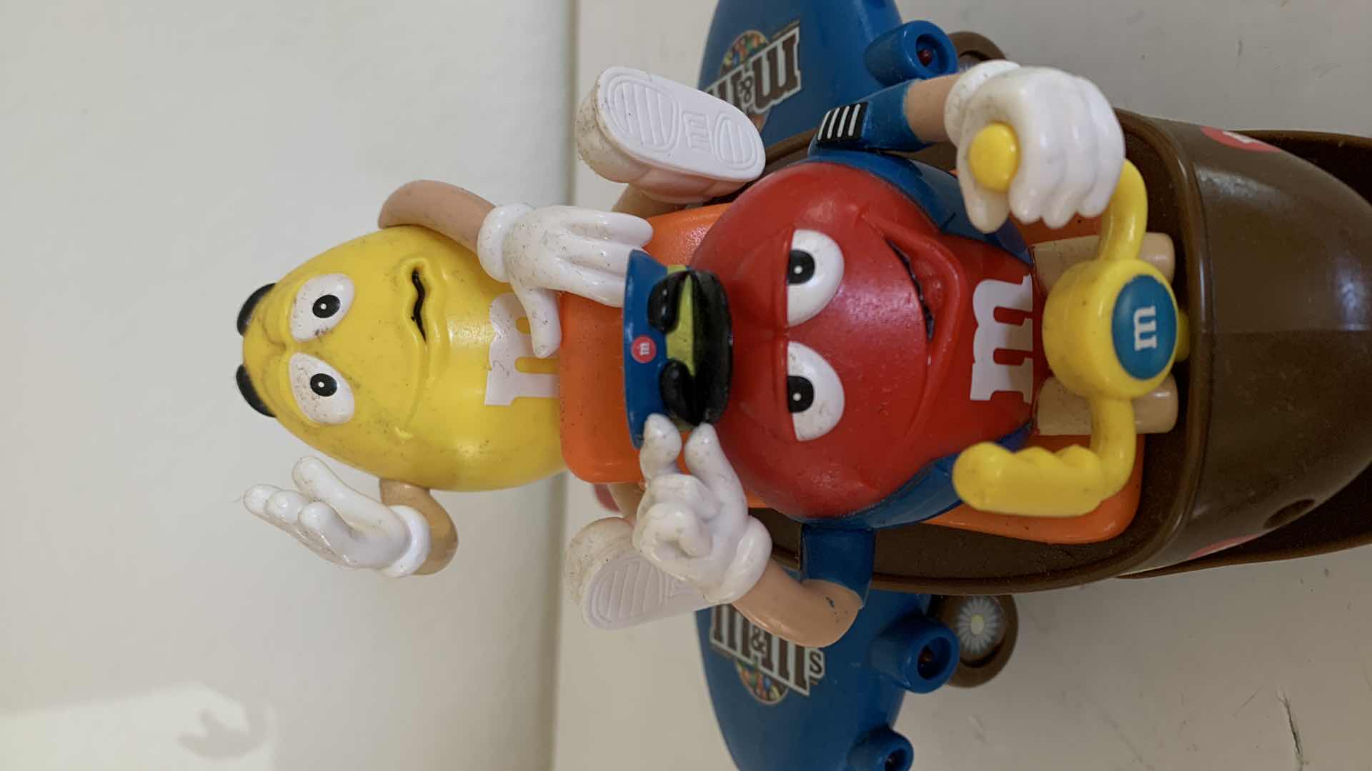 Photo 1 of M & M RED AND YELLOW ON AIRPLANE. COLLECTIBLE CANDY DISPENSER.