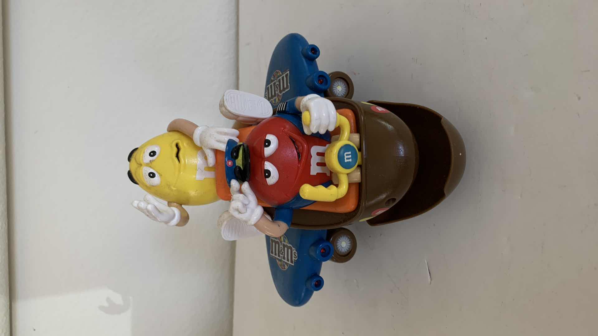 Photo 1 of M & M RED AND YELLOW ON AIRPLANE. COLLECTIBLE CANDY DISPENSER.