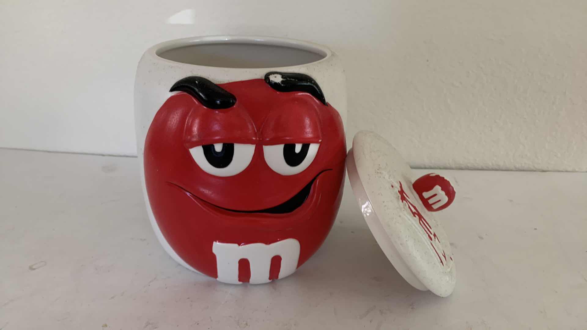 Photo 1 of M & Ms RED CERAMIC CANISTER.