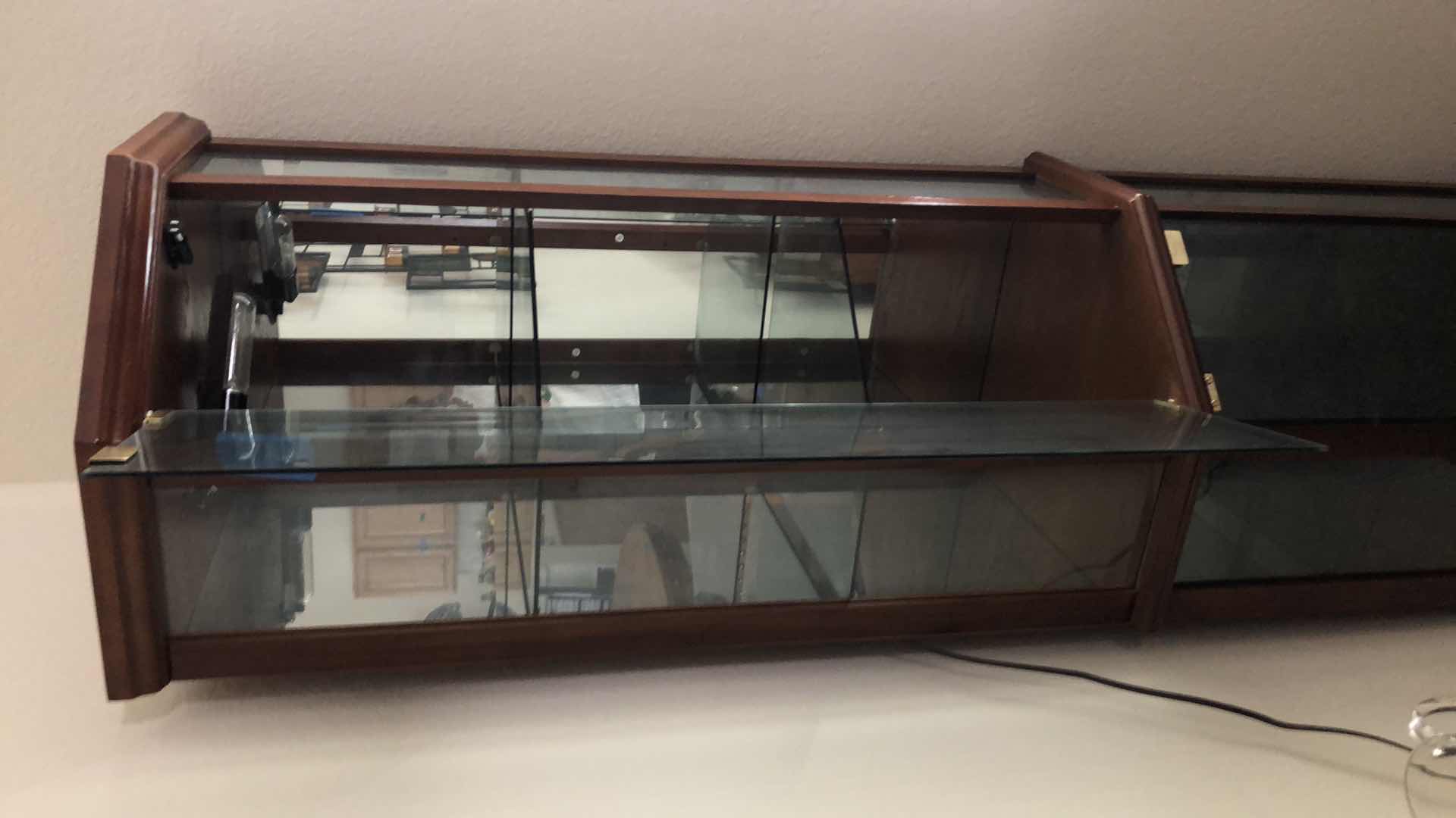 Photo 4 of LIGHTED WOOD AND GLASS CURIO CABINET, 24x16” H70”