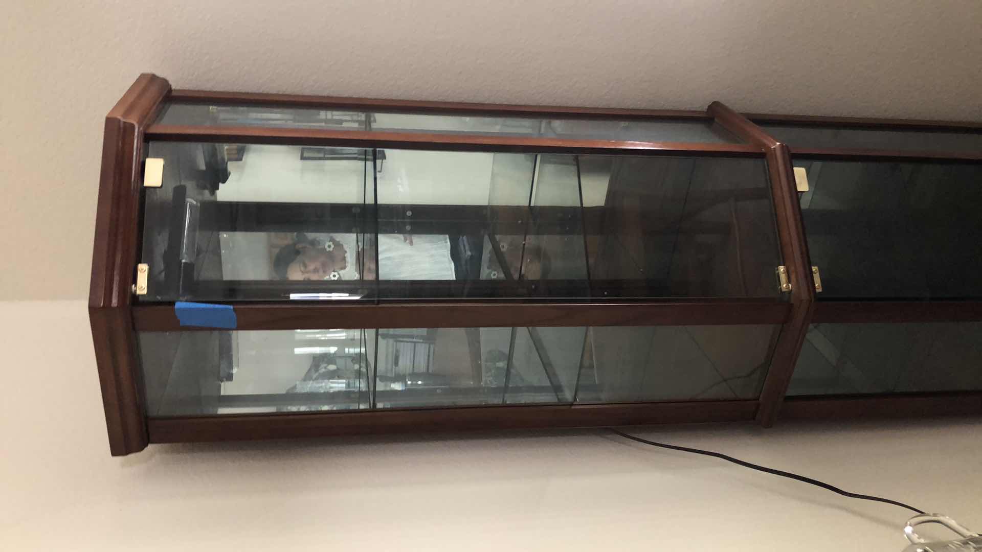 Photo 2 of LIGHTED WOOD AND GLASS CURIO CABINET, 24x16” H70”