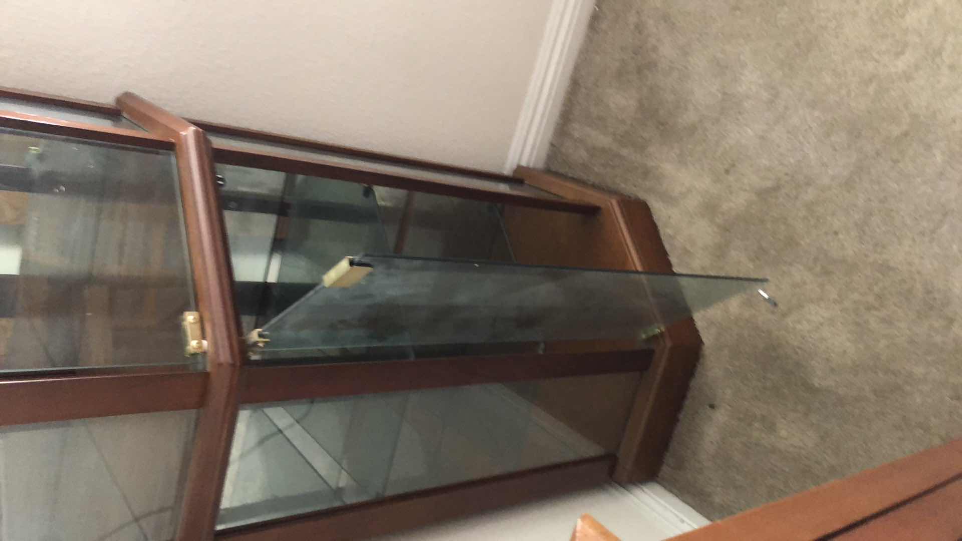 Photo 1 of LIGHTED WOOD AND GLASS CURIO CABINET, 24x16” H70”