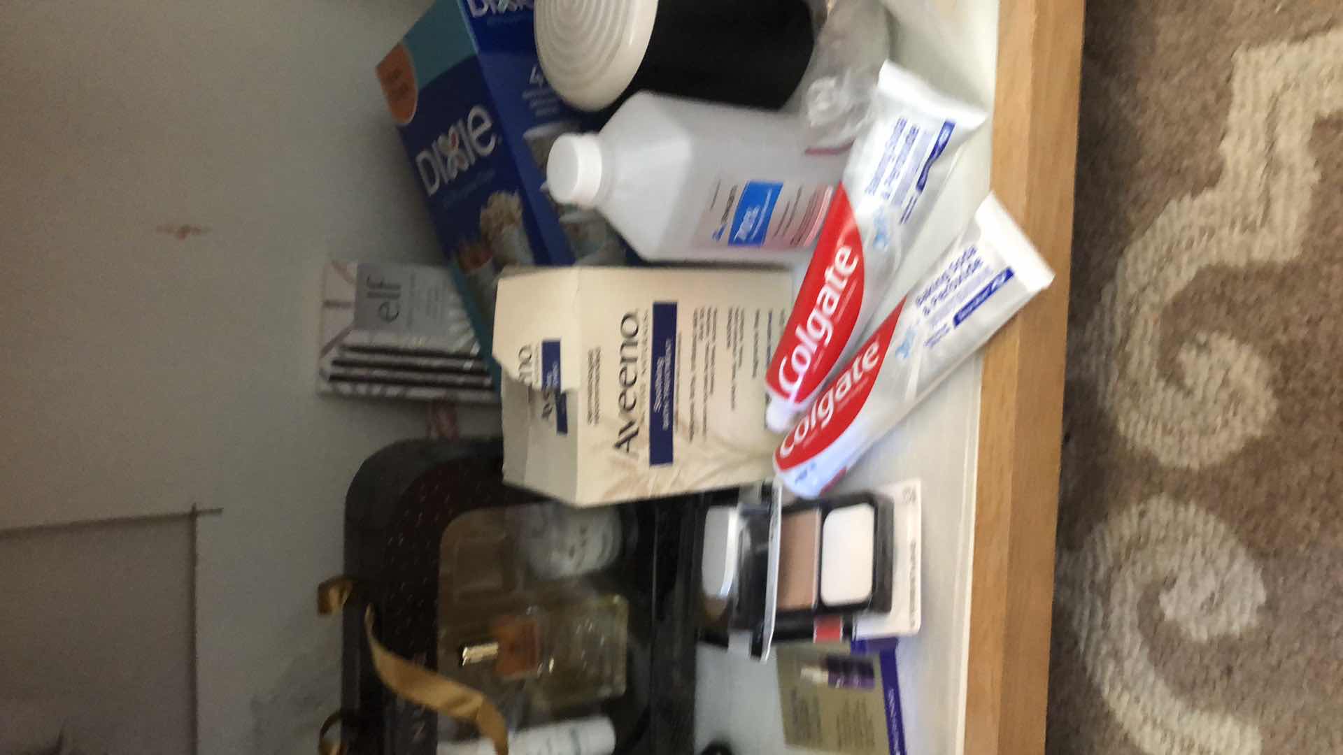 Photo 1 of CONTENTS UNDER BATHROOM SINK INCLUDING RUG, BLOW DRYERS, NEW MAKEUP, TOOTHPASTE AND MORE