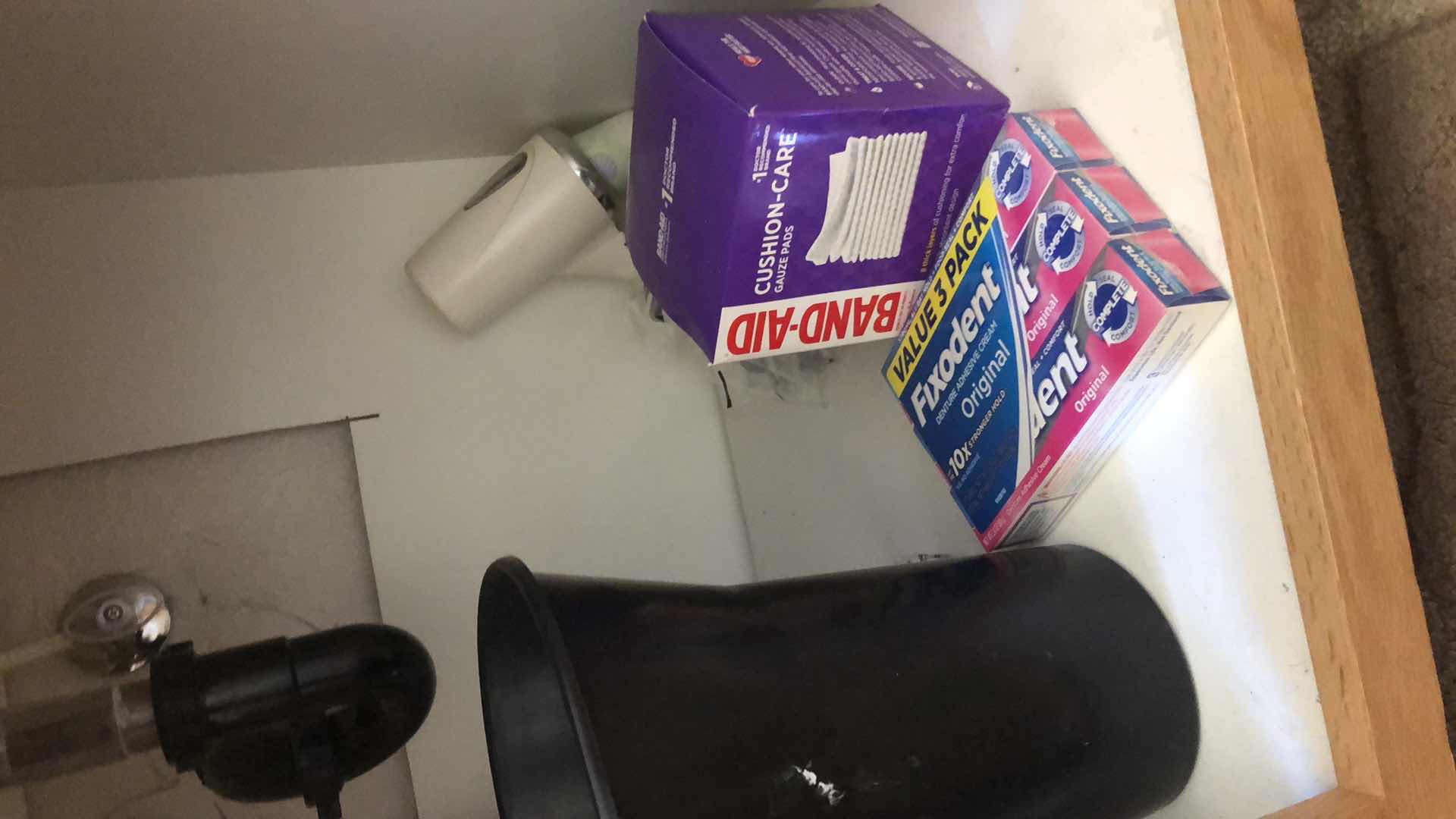 Photo 1 of CONTENTS UNDER BATHROOM SINK INCLUDING RUG, BLOW DRYERS, NEW MAKEUP, TOOTHPASTE AND MORE