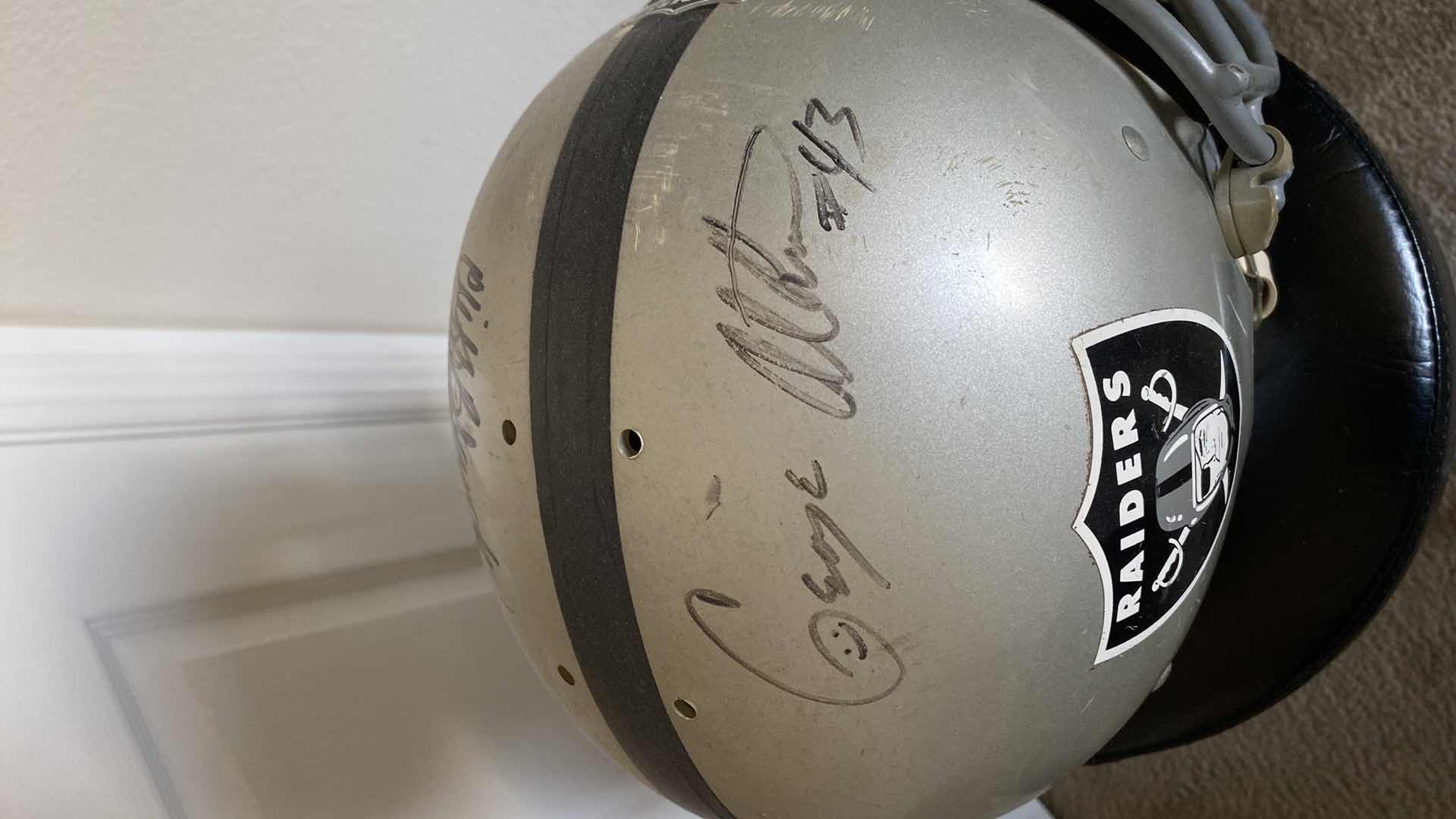 Photo 1 of RAIDERS HELMET WITH AUTOGRAPHS UNAUTHENTICATED