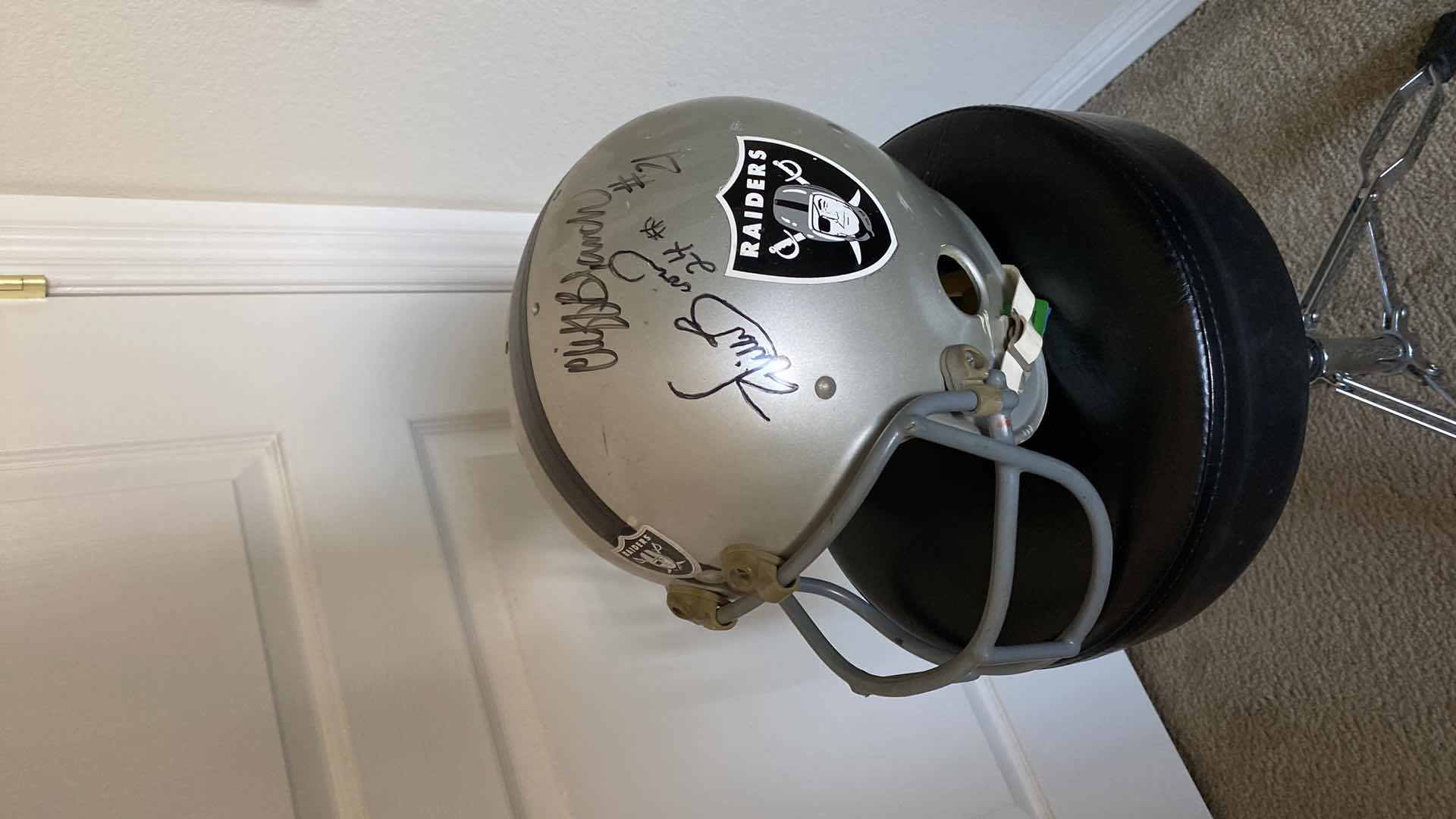 Photo 1 of RAIDERS HELMET WITH AUTOGRAPHS UNAUTHENTICATED