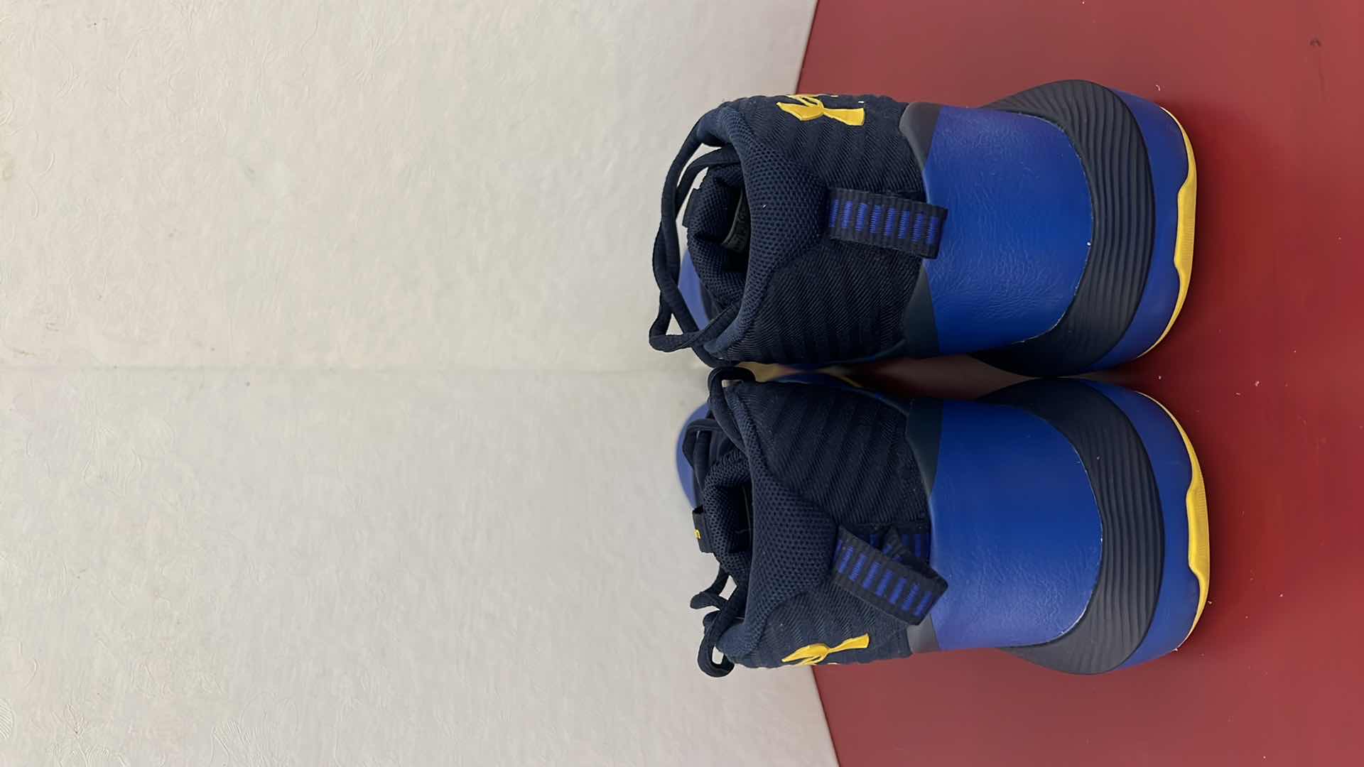 Photo 1 of LADIES UNDER ARMOUR ROYAL BLUE W YELLOW ATHLETIC SHOES (SIZE 7)