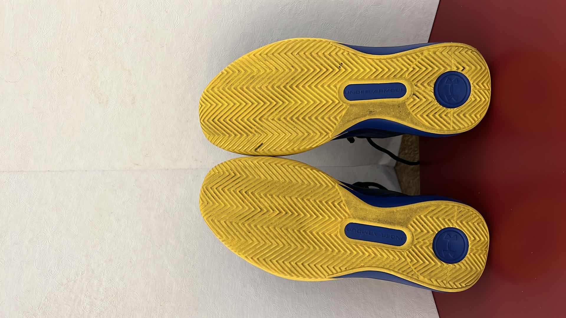 Photo 1 of LADIES UNDER ARMOUR ROYAL BLUE W YELLOW ATHLETIC SHOES (SIZE 7)