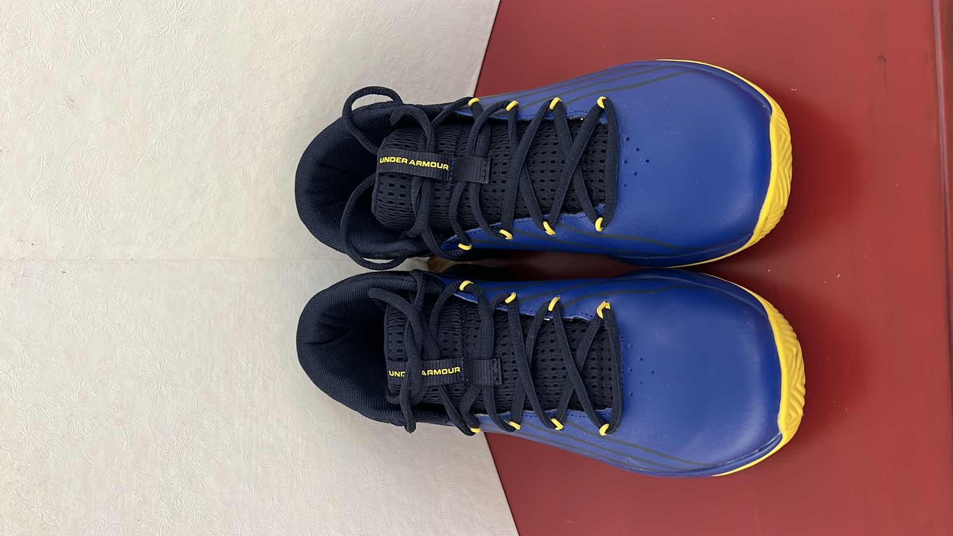 Photo 1 of LADIES UNDER ARMOUR ROYAL BLUE W YELLOW ATHLETIC SHOES (SIZE 7)