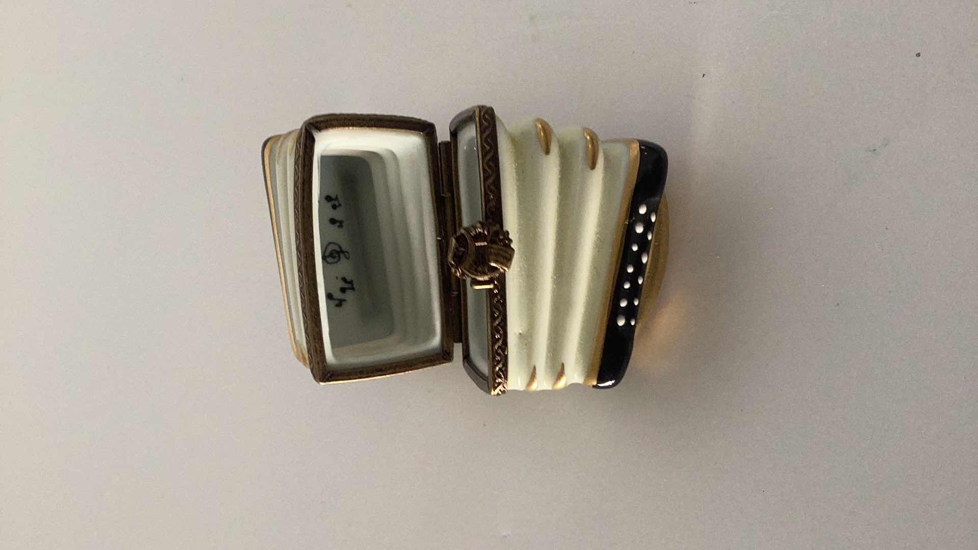 Photo 1 of LIMOGES FRANCE ACCORDIAN PILL BOX 3” WIDE 