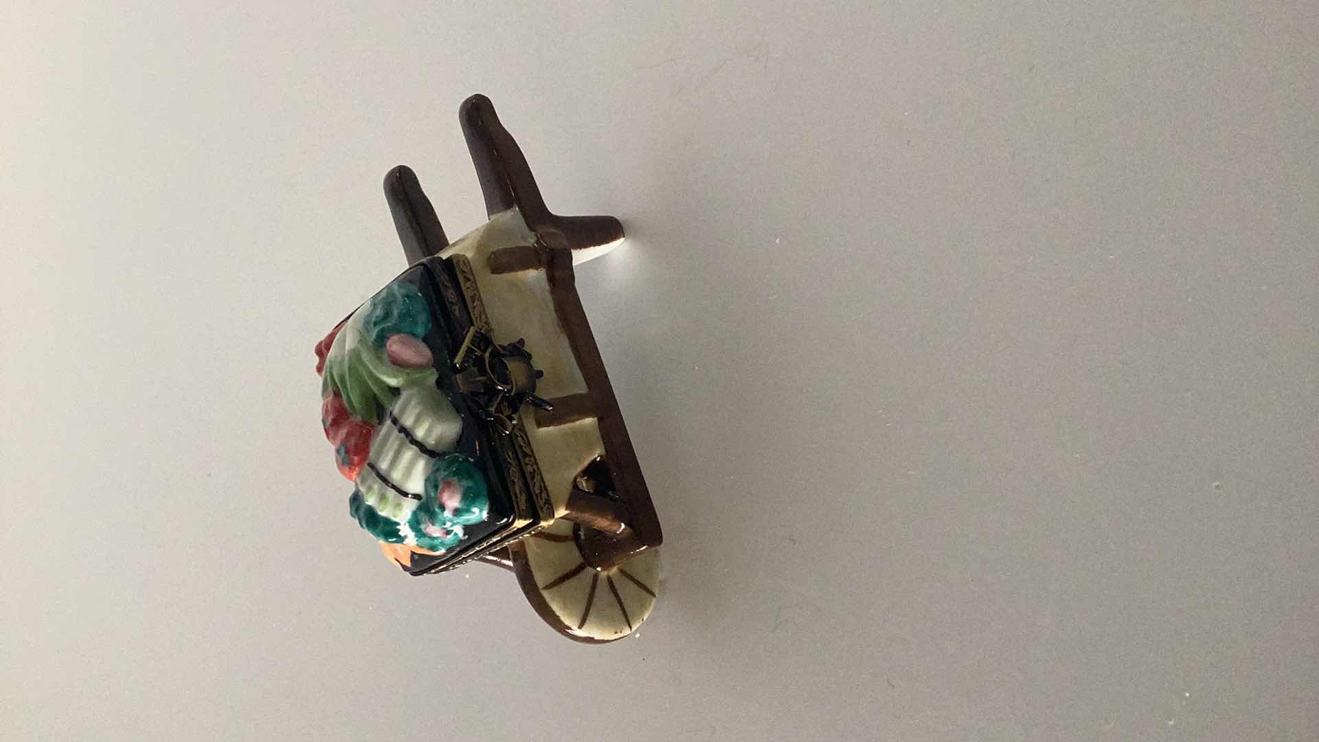 Photo 1 of LIMOGES FRANCE WHEELBARROW WITH VEGETABLES 3 1/2” LONG 