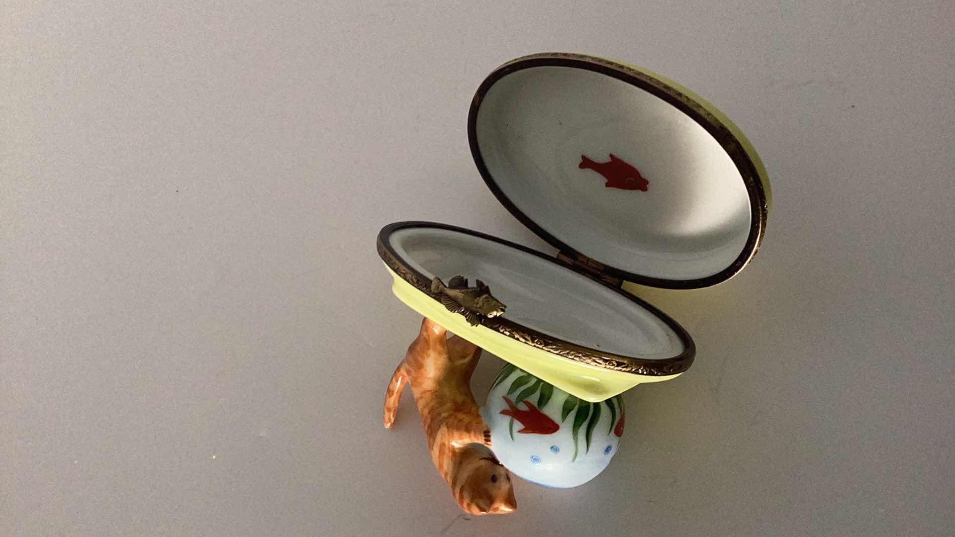 Photo 1 of LIMOGES FRANCE CAT WITH GOLDFISH BOWL PILLBOX 3” LONG 
