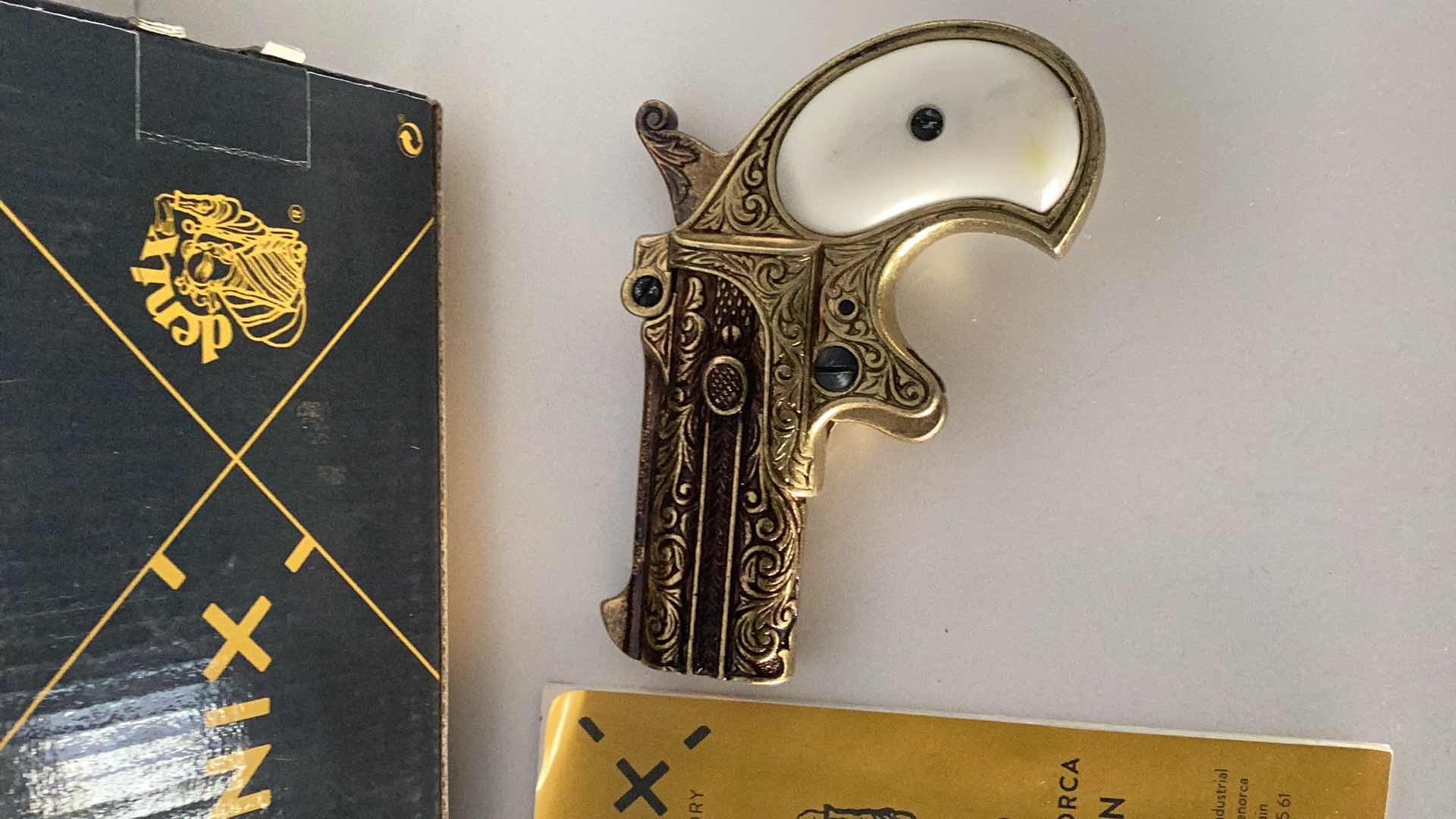 Photo 1 of DENIX BRASS DOUBLE BARRELED DERRINGER 4 1/2” LONG 