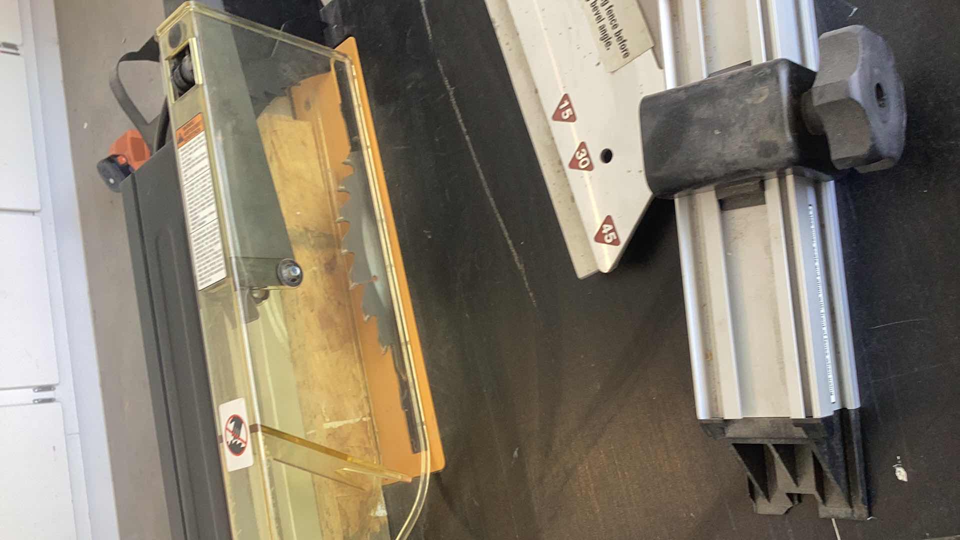 Photo 1 of RYOBI 10” PORTABLE TABLE SAW WITH STAND