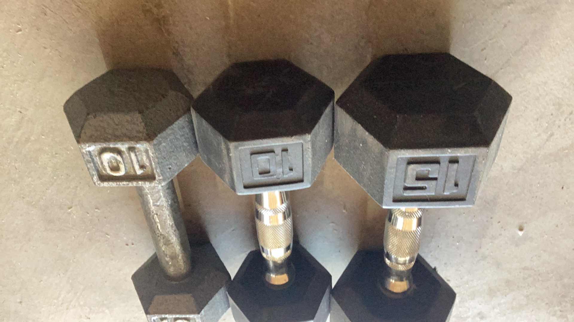 Photo 1 of 3 DUMB BELLS 10, 10, AND A 15 POUND