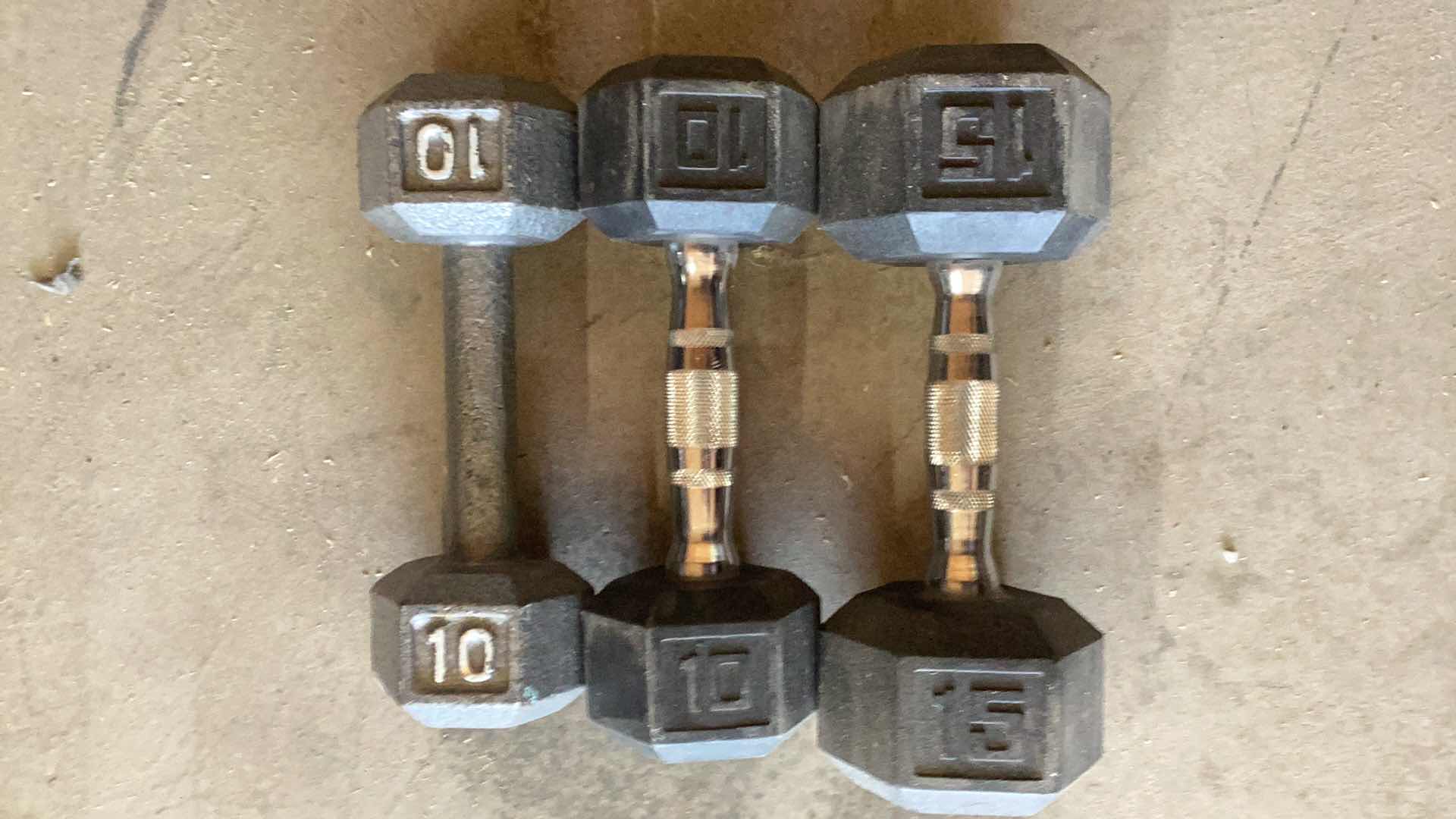 Photo 1 of 3 DUMB BELLS 10, 10, AND A 15 POUND