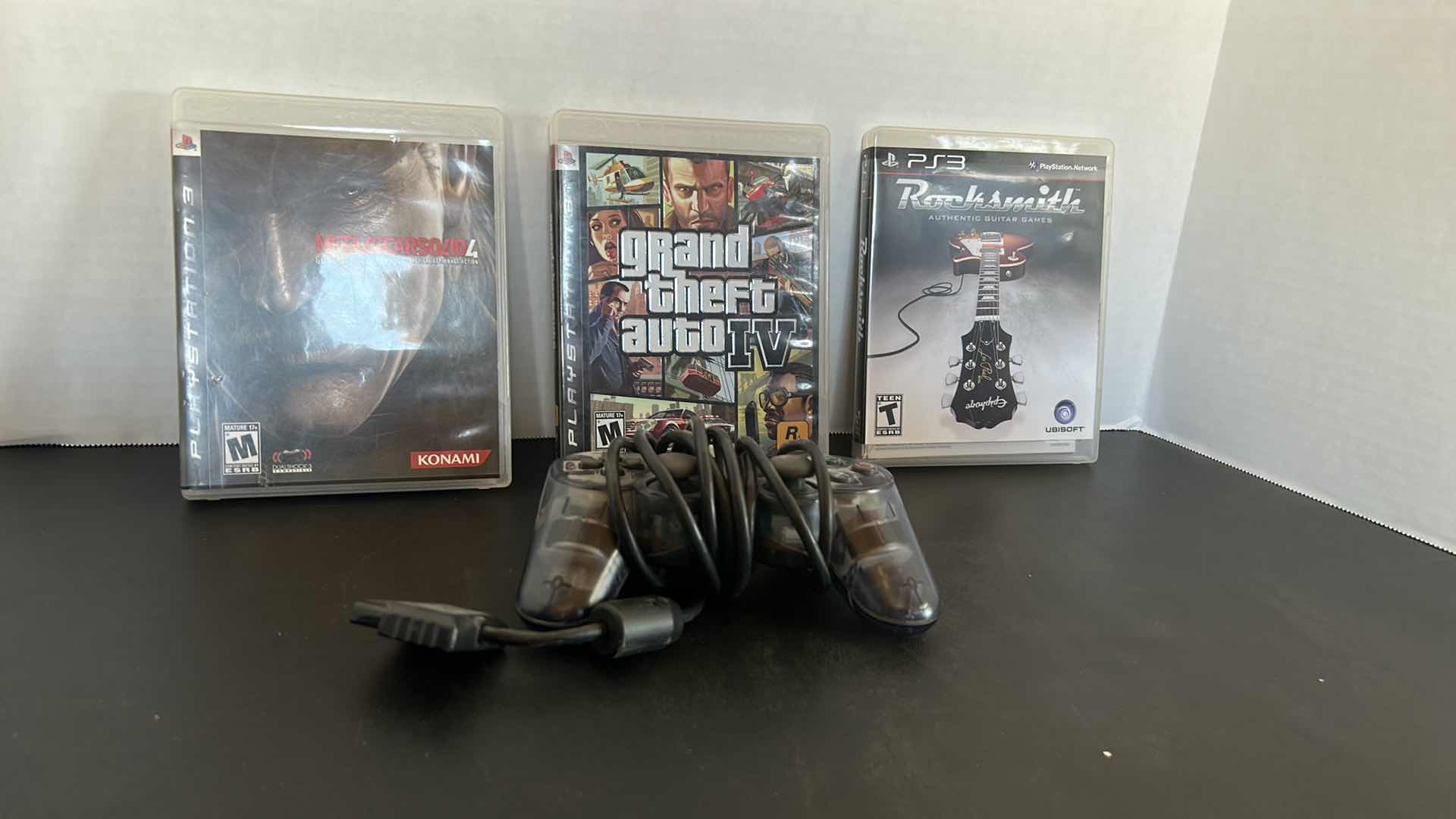 Photo 1 of 3 PS3 GAMES AND 1 CONTROLLER
