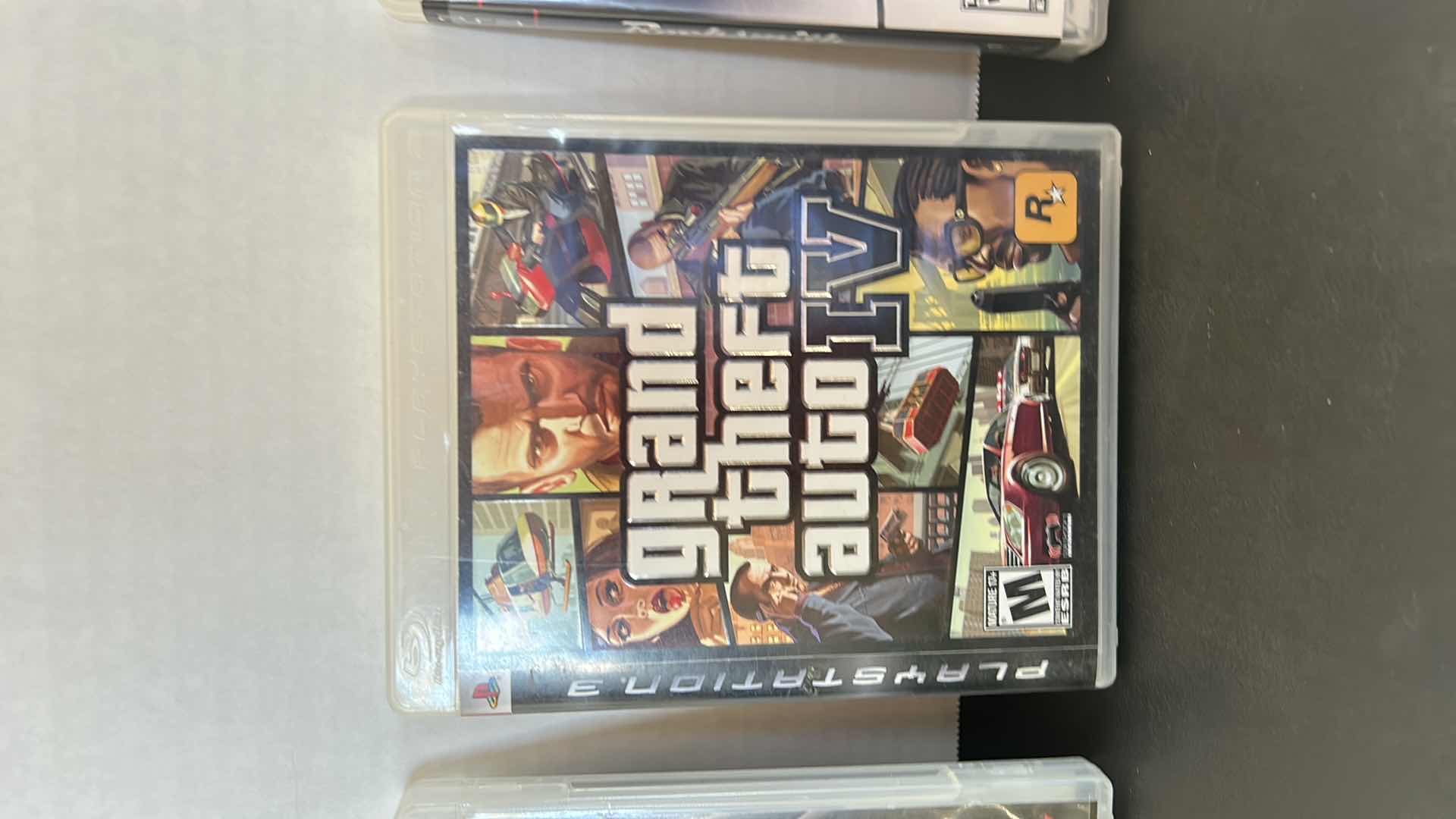 Photo 1 of 3 PS3 GAMES AND 1 CONTROLLER